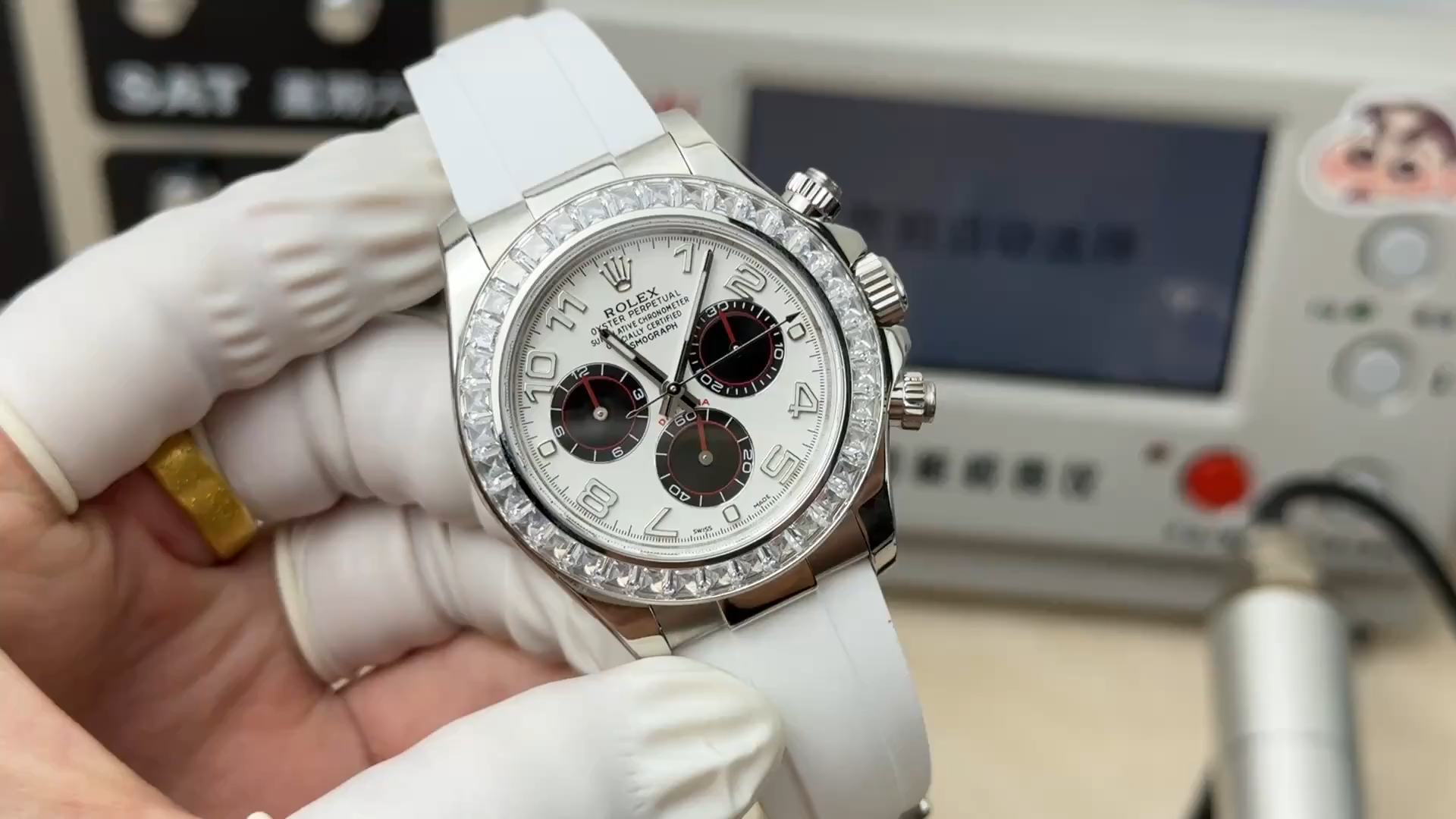 Rolex Daytona 116519, front view on white rubber strap held in hand. - Video