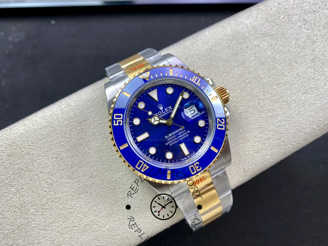 Rolex Submariner 126613LB small full watch shot, blue bezel ring and gold crown highlighted.