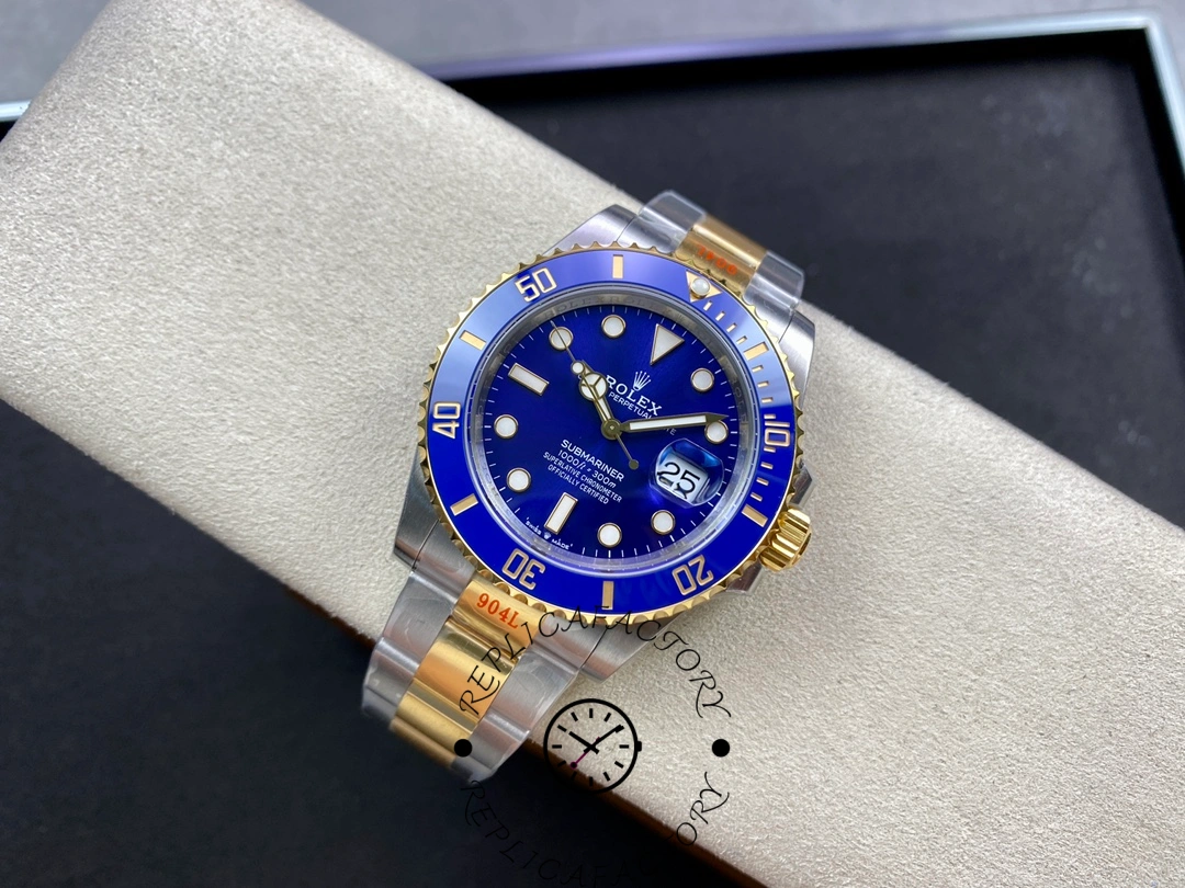 Rolex Submariner 126613LB on wrist rest, showing two-tone links and blue dial proportions.