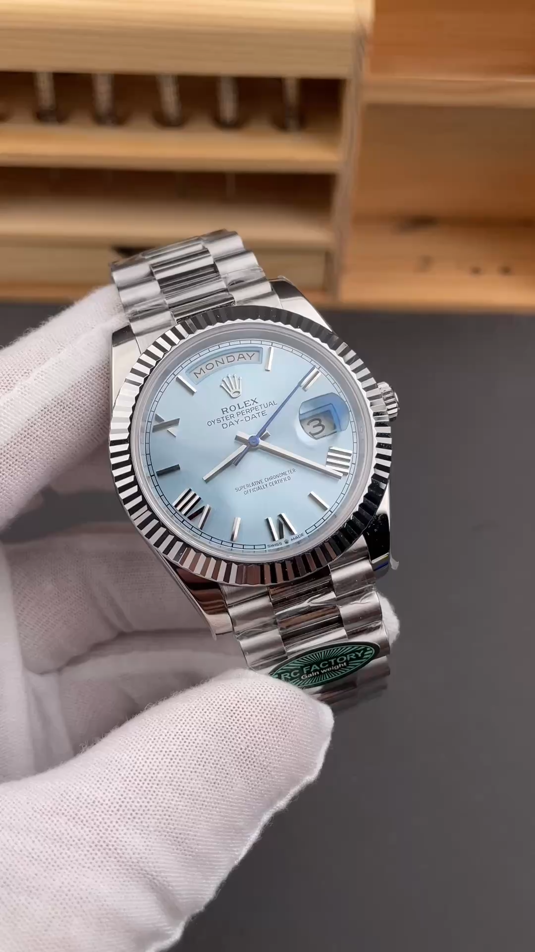 Rolex Day-Date 228236-0012 video cover showing the watch held in hand from a front-left angle. - Video