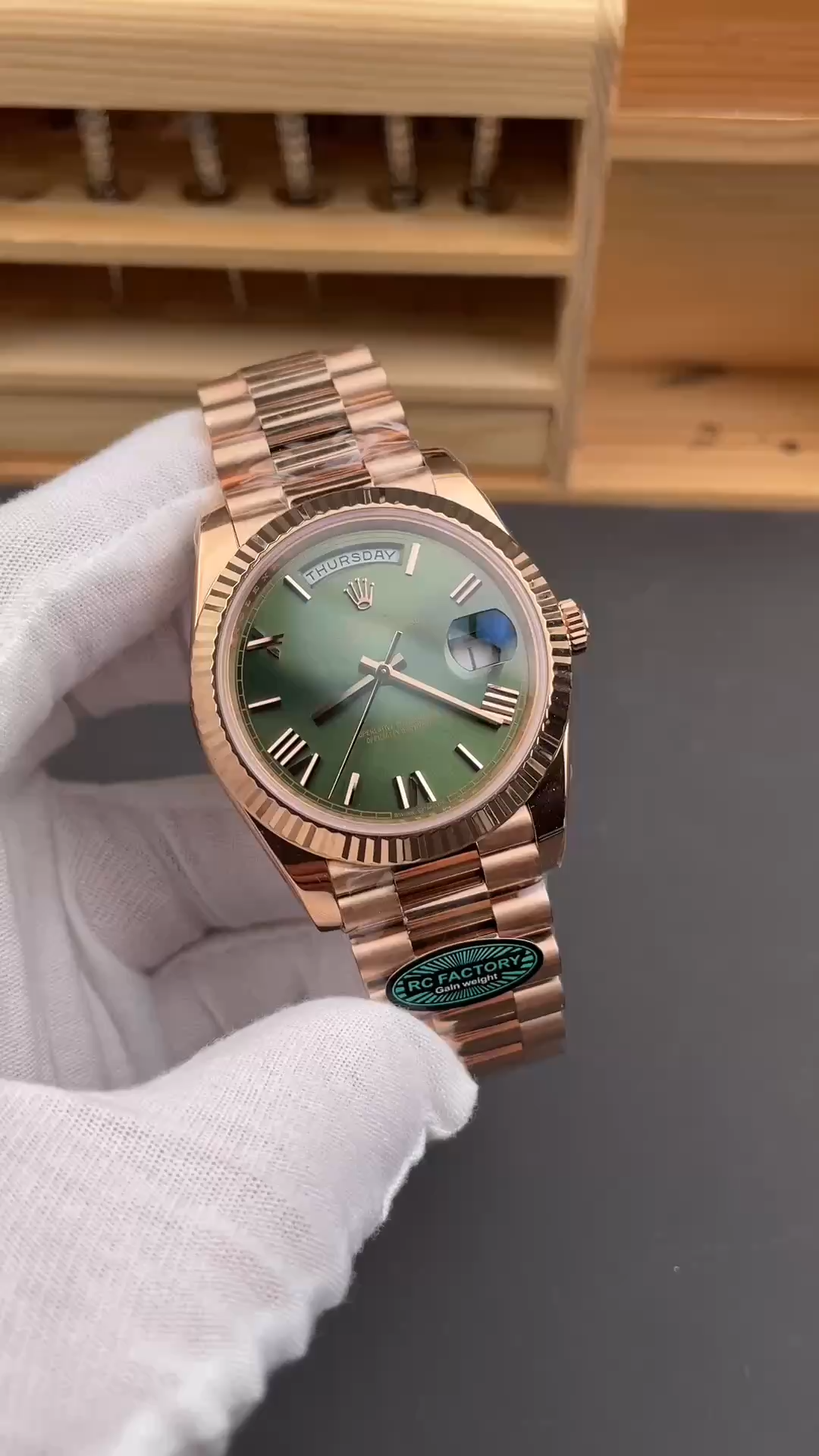 Video of Rolex Day-Date 40 m228235-0025 showing the watch held in a gloved hand. - Video