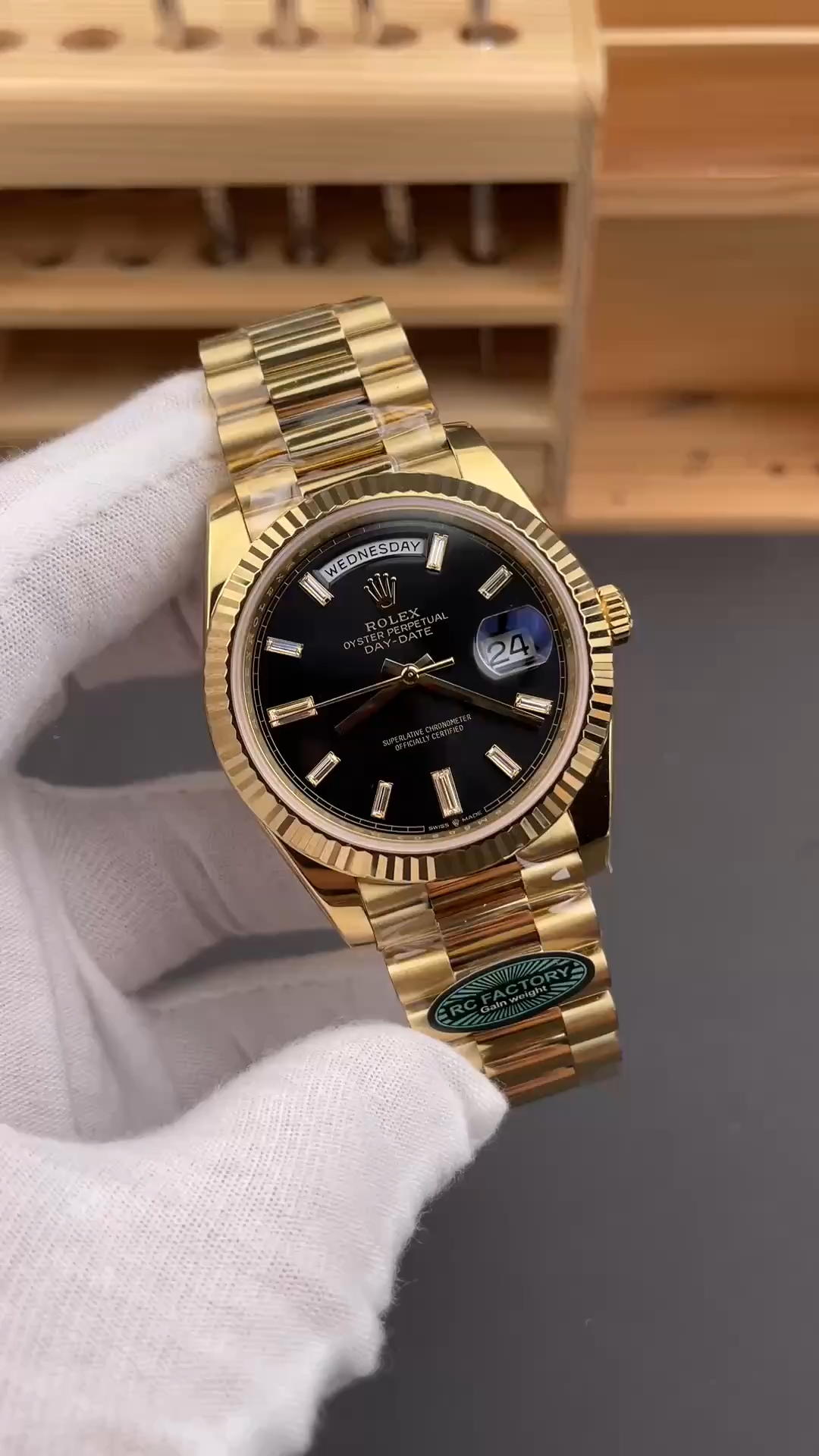 Side wrist view of the Rolex Day-Date 228238-0004 showing the gold case and bracelet profile. - Video