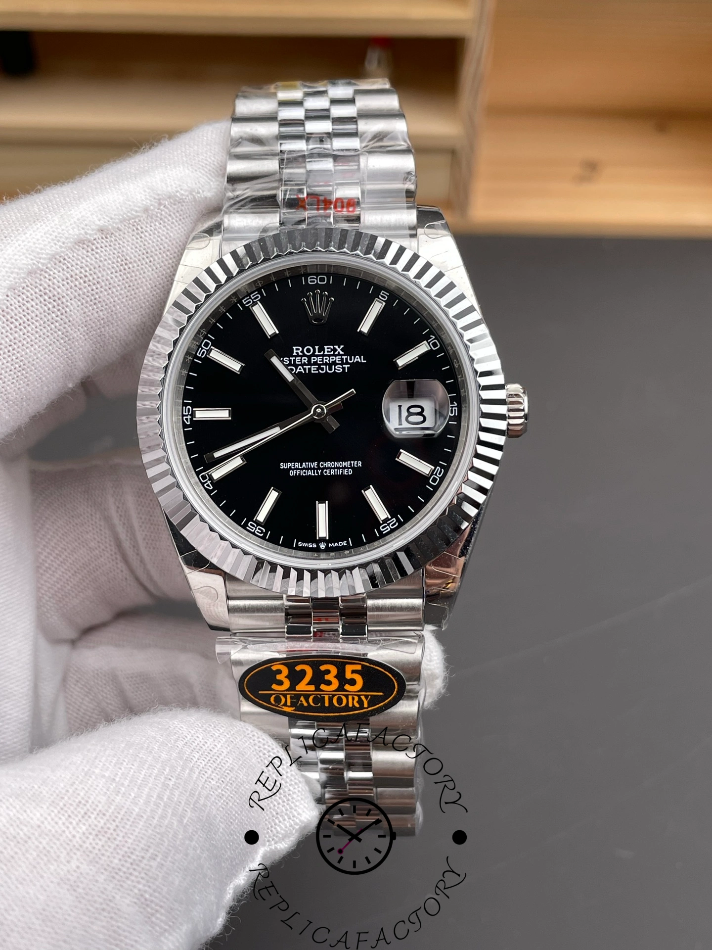 Front close-up of the Rolex Datejust 126334-0018 with black dial, date window, and Jubilee bracelet.