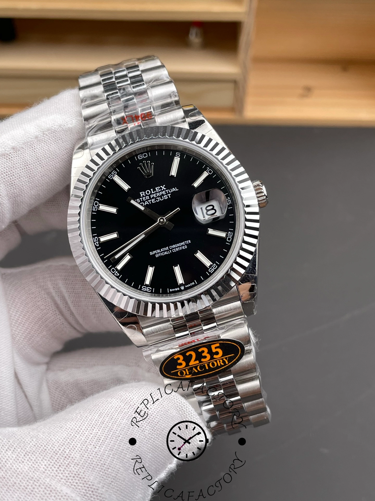 Angled front view of the Rolex Datejust 126334-0018 showing the black dial and fluted bezel.