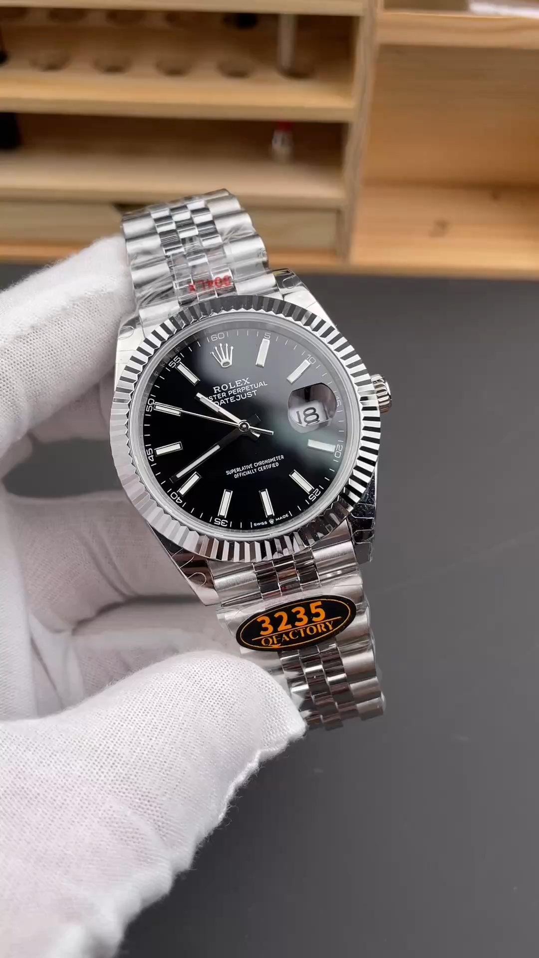 Handheld view of the Rolex Datejust 126334-0018 with black dial and Jubilee bracelet. - Video