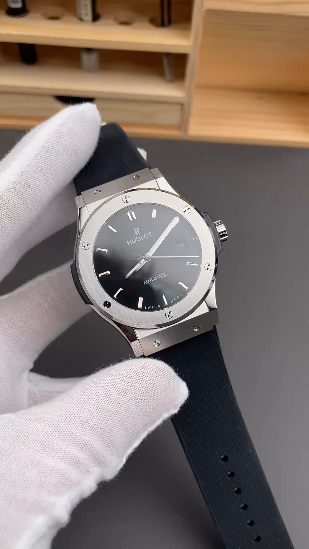 Gloved hold of Hublot Classic Fusion 542.NX.1171.RX, showing lugs and strap connection. - Video