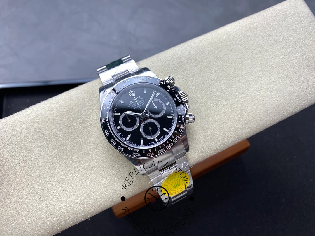 Full watch on cushion of Rolex Cosmograph Daytona m126500ln-0002 showing Oyster bracelet fit.