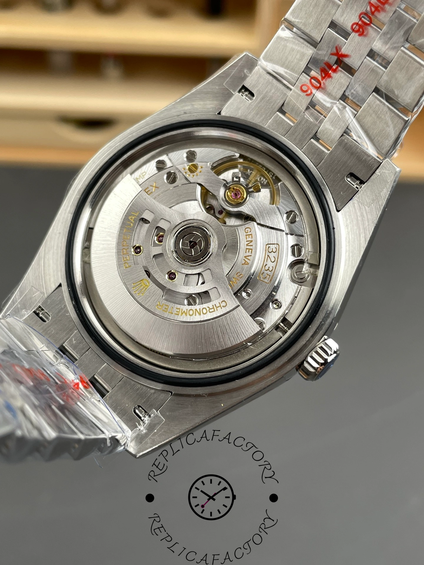 Movement view of the Rolex Datejust 126334-0018 showing the automatic rotor through the open caseback.