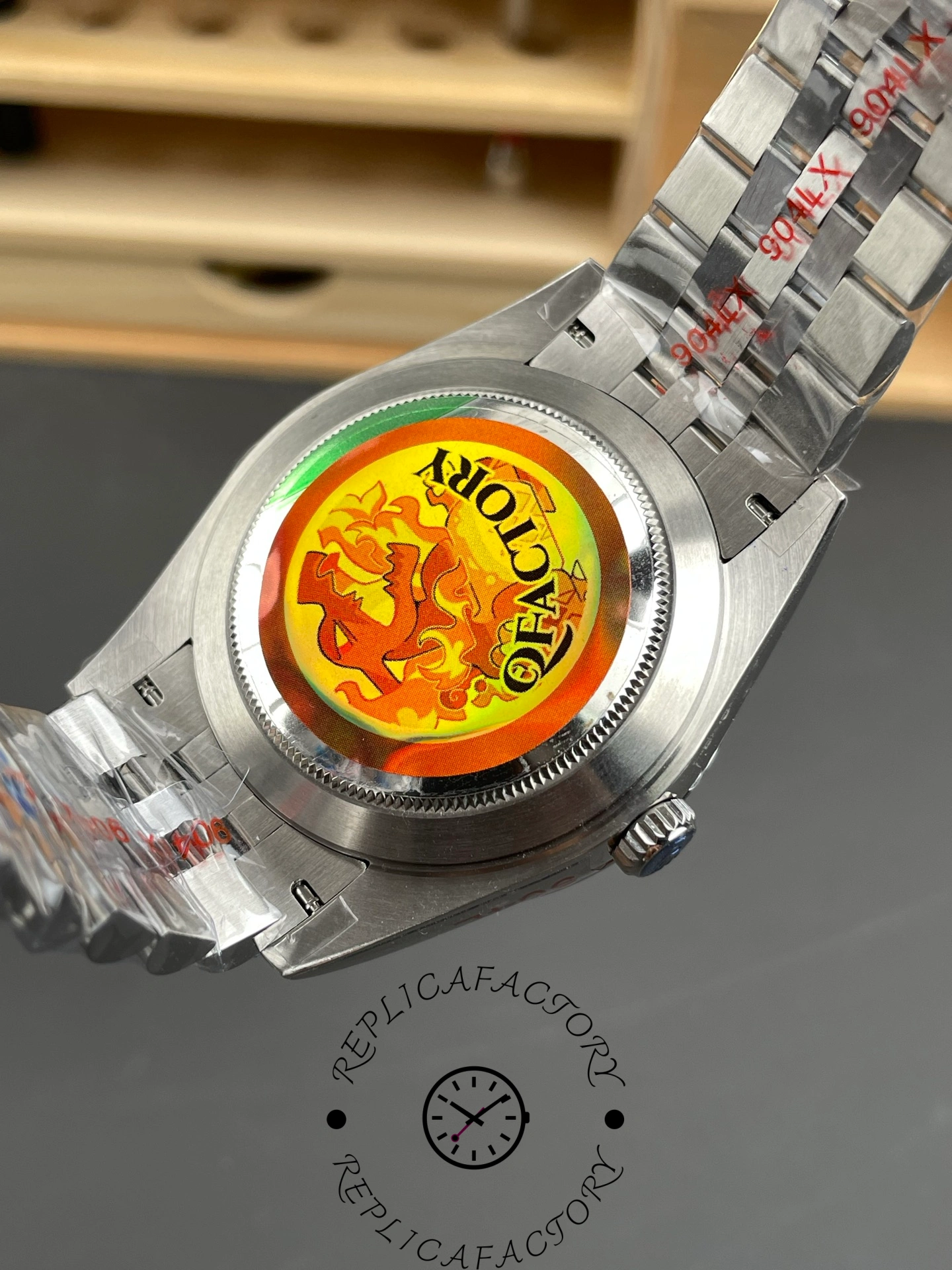 Caseback view of the Rolex Datejust 126334-0018 showing the rear cover with a colorful factory sticker.