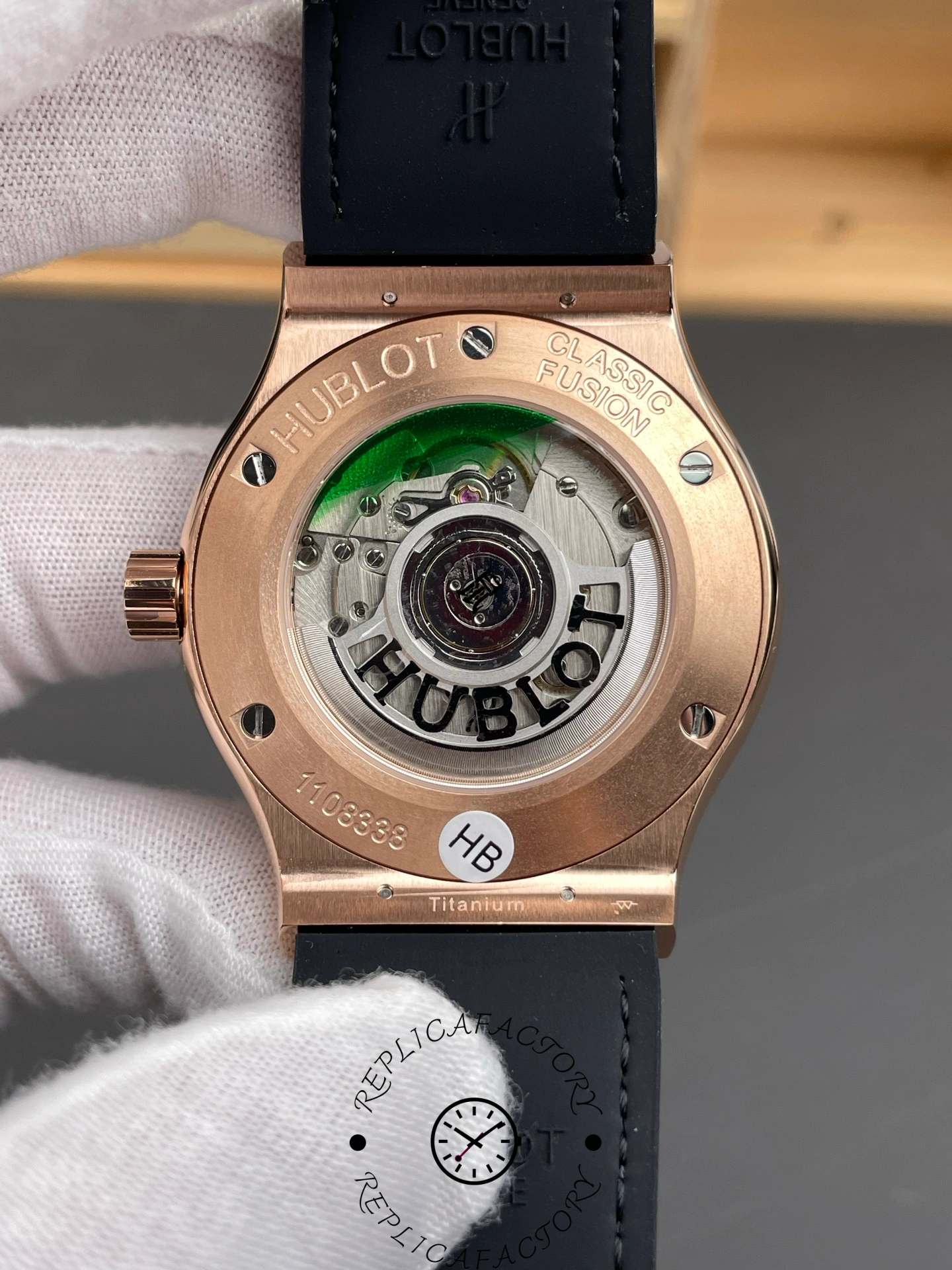 Caseback view of Hublot 511.OX.7081.LR showing exhibition back and rotor detail.