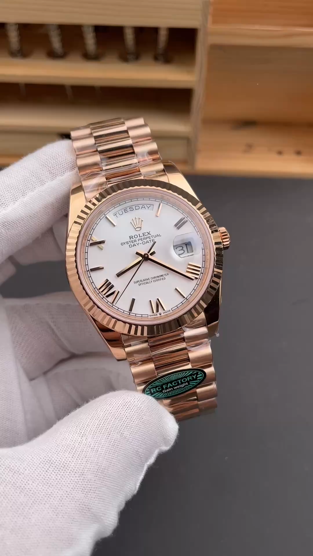Video image of Rolex Day-Date 228235 showing the white dial and Everose-style bracelet. - Video