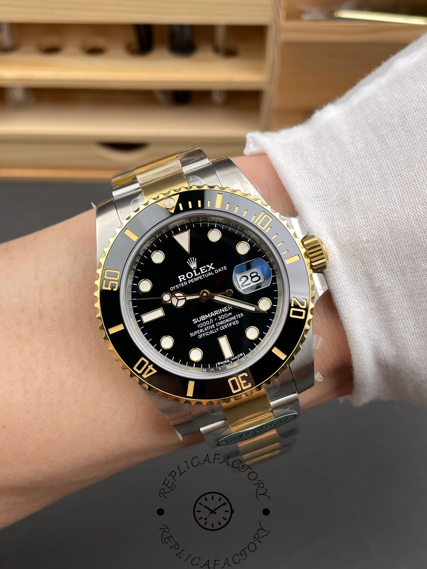 Rolex Submariner 126613LN 0002 wrist shot, black dial and bezel on two-tone bracelet.
