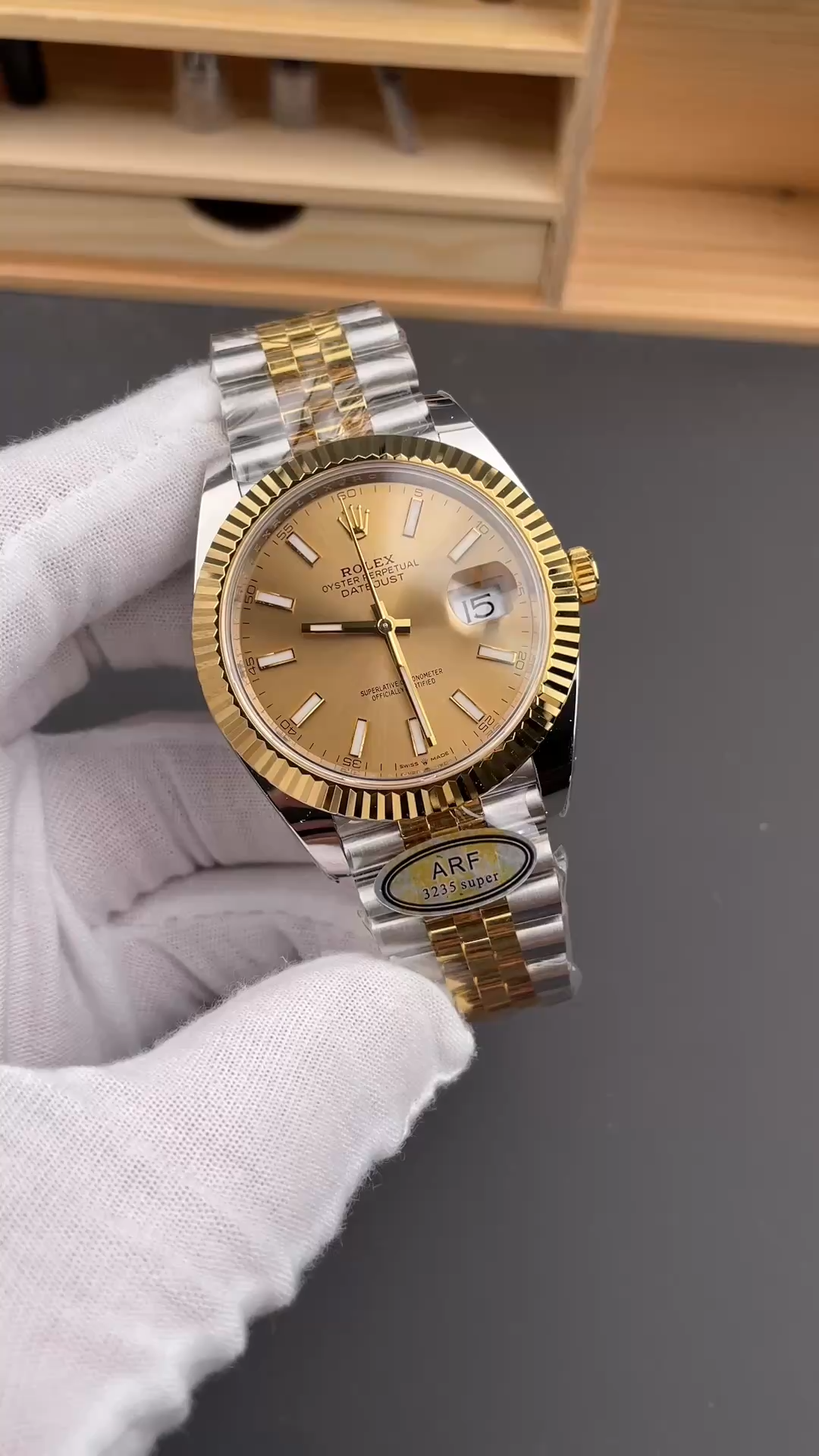Angled front view of Rolex Datejust 126333-0010 on glove, showing champagne dial and Jubilee bracelet. - Video
