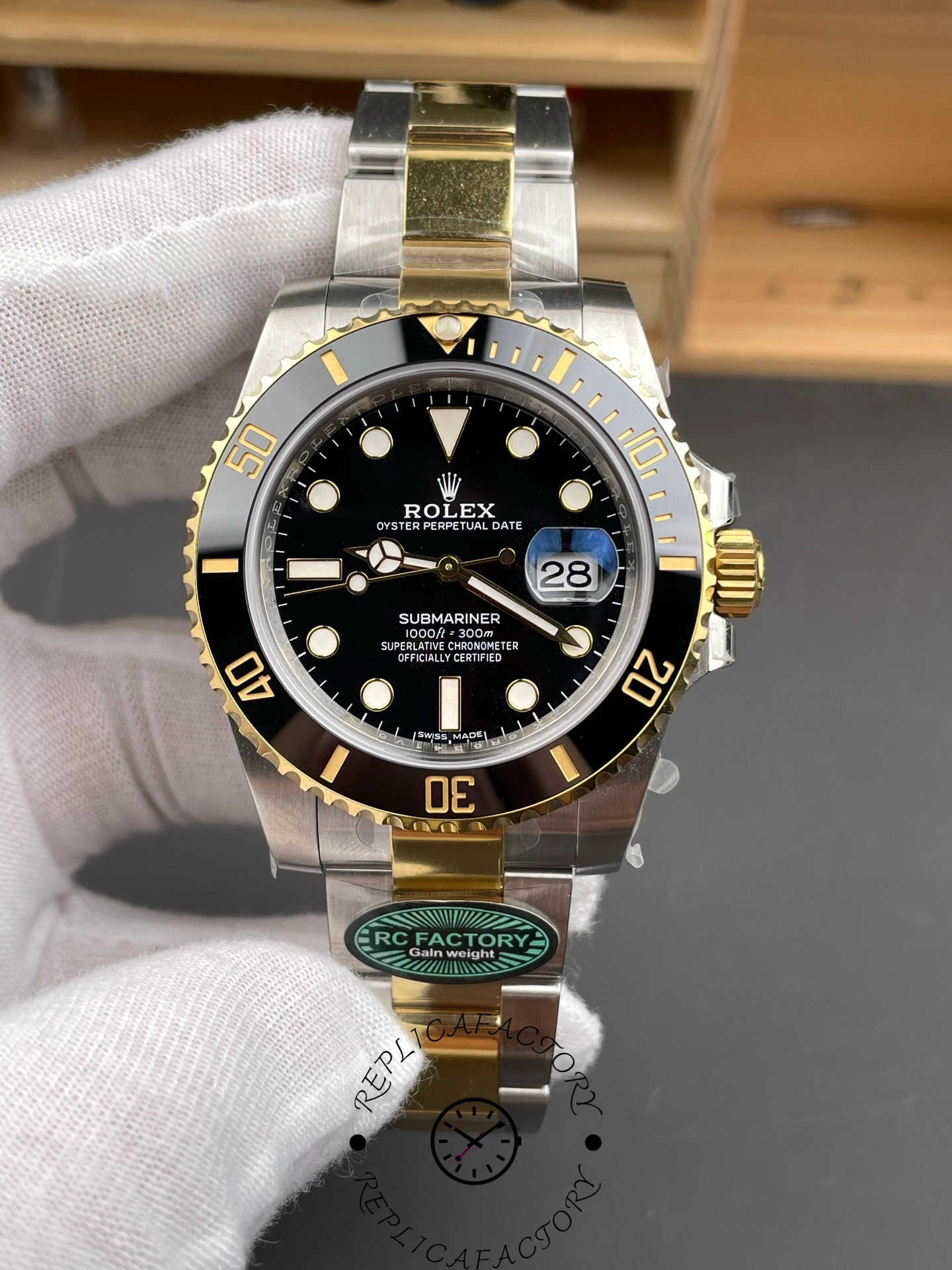 Rolex Submariner 126613LN 0002 straight-on dial shot in glove, luminous markers and date window.