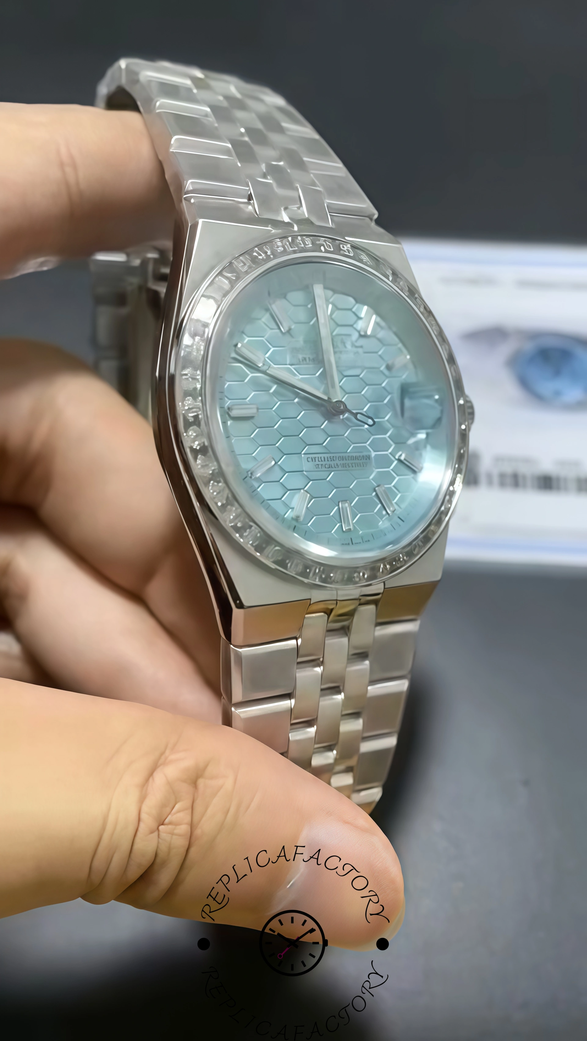 Handheld angled view of Rolex Land-Dweller 40 127386TBR-0001 Replica showing polished case and diamond bezel.