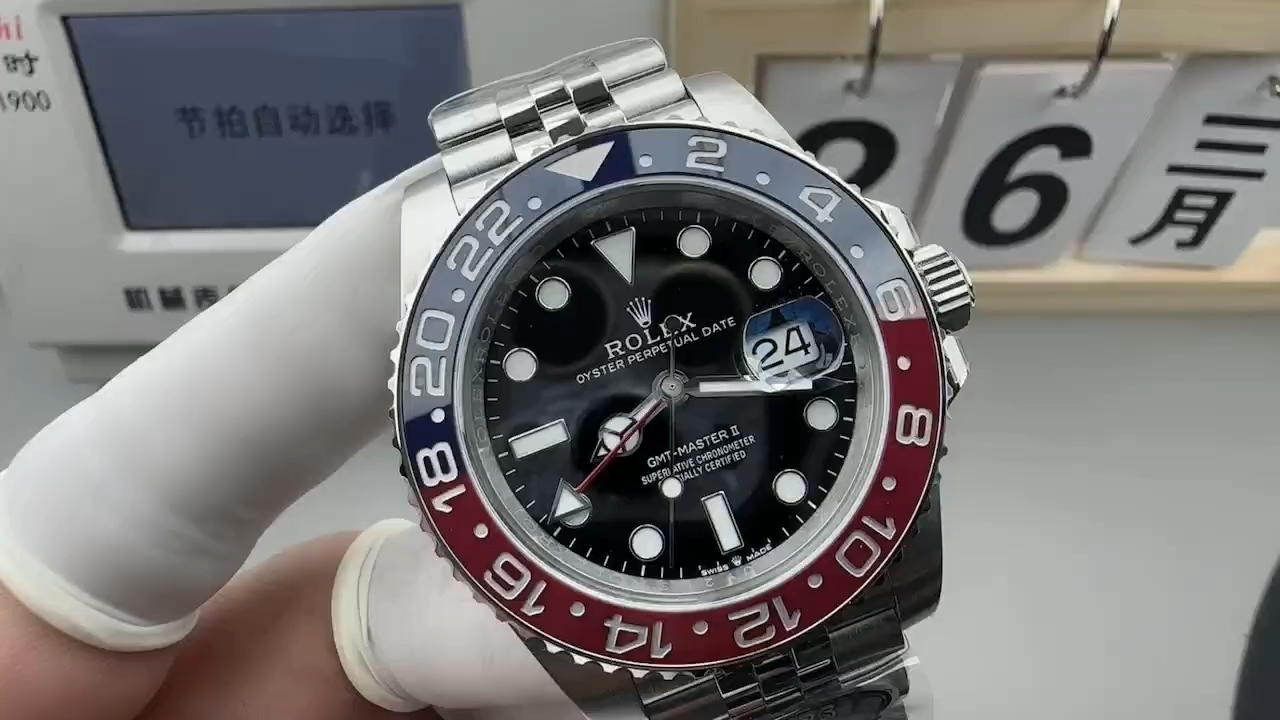 Rolex GMT-Master II 126710BLRO, video showing the watch in hand near a box.