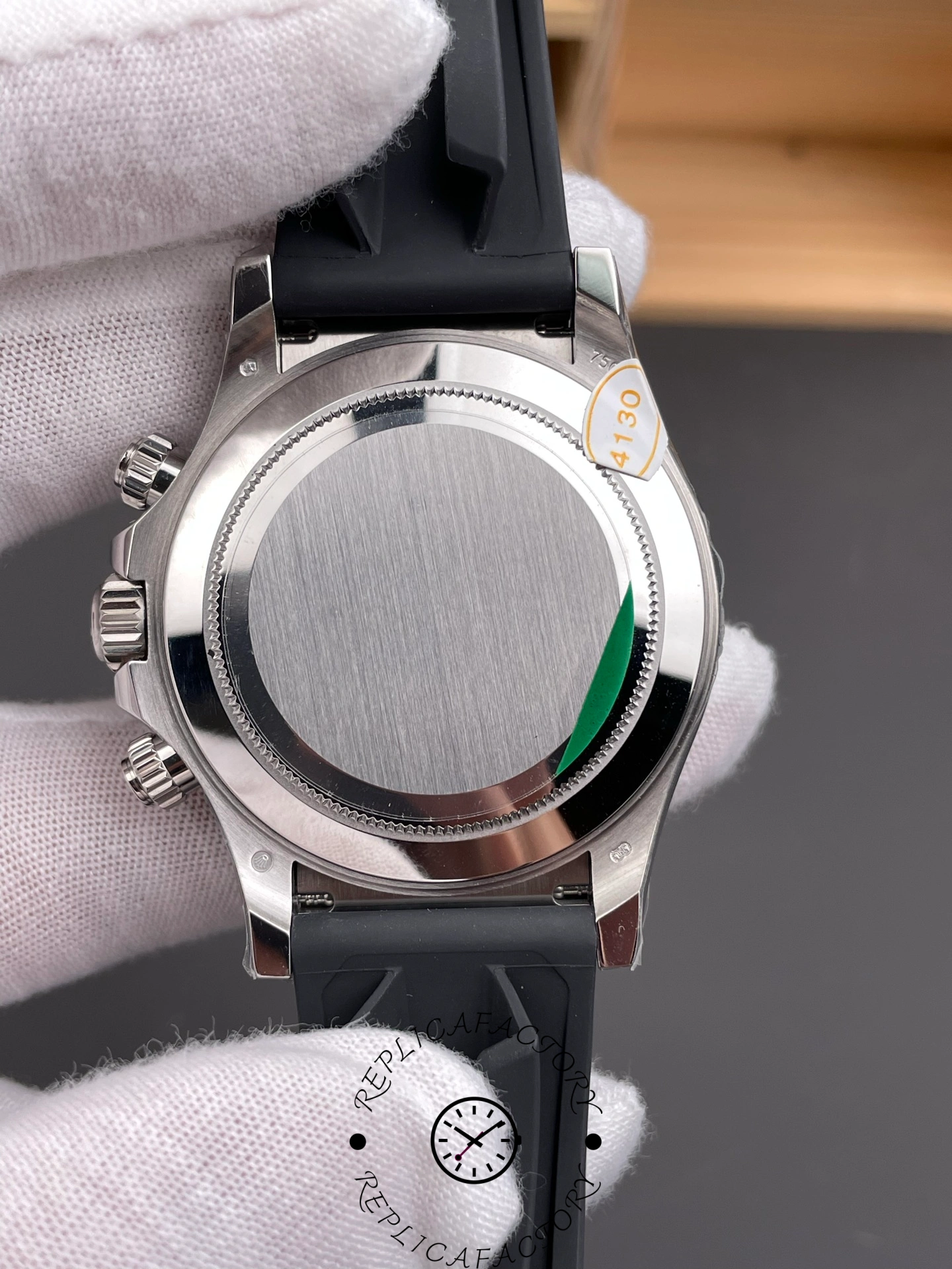 Rolex Daytona 126519LN 0007, caseback view with protective sticker on back.