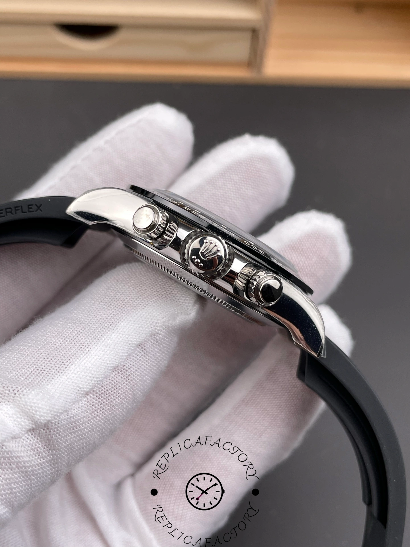 Rolex Daytona 126519LN 0007, side view showing crown and chronograph pushers.