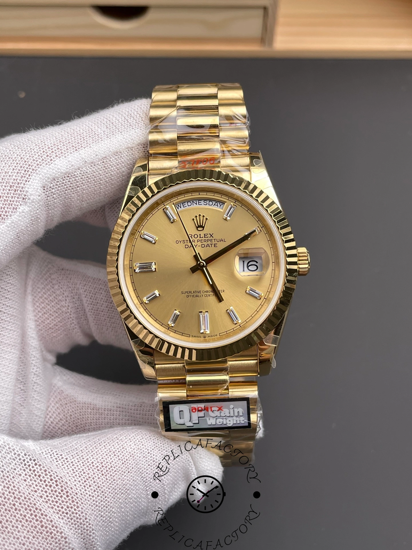Front view of the Rolex Day-Date m228238-0005 with champagne dial, day window, and date display.