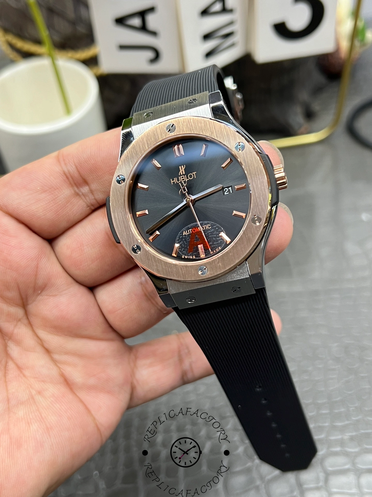 Handheld full watch of Hublot Classic Fusion 542.NO.1181.RX showing the rubber strap and lug fit.