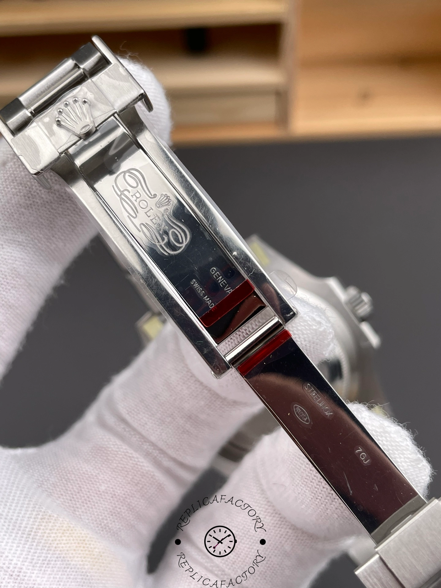 Rolex Submariner 126610LN 0001 clasp and bracelet detail, shown in glove.