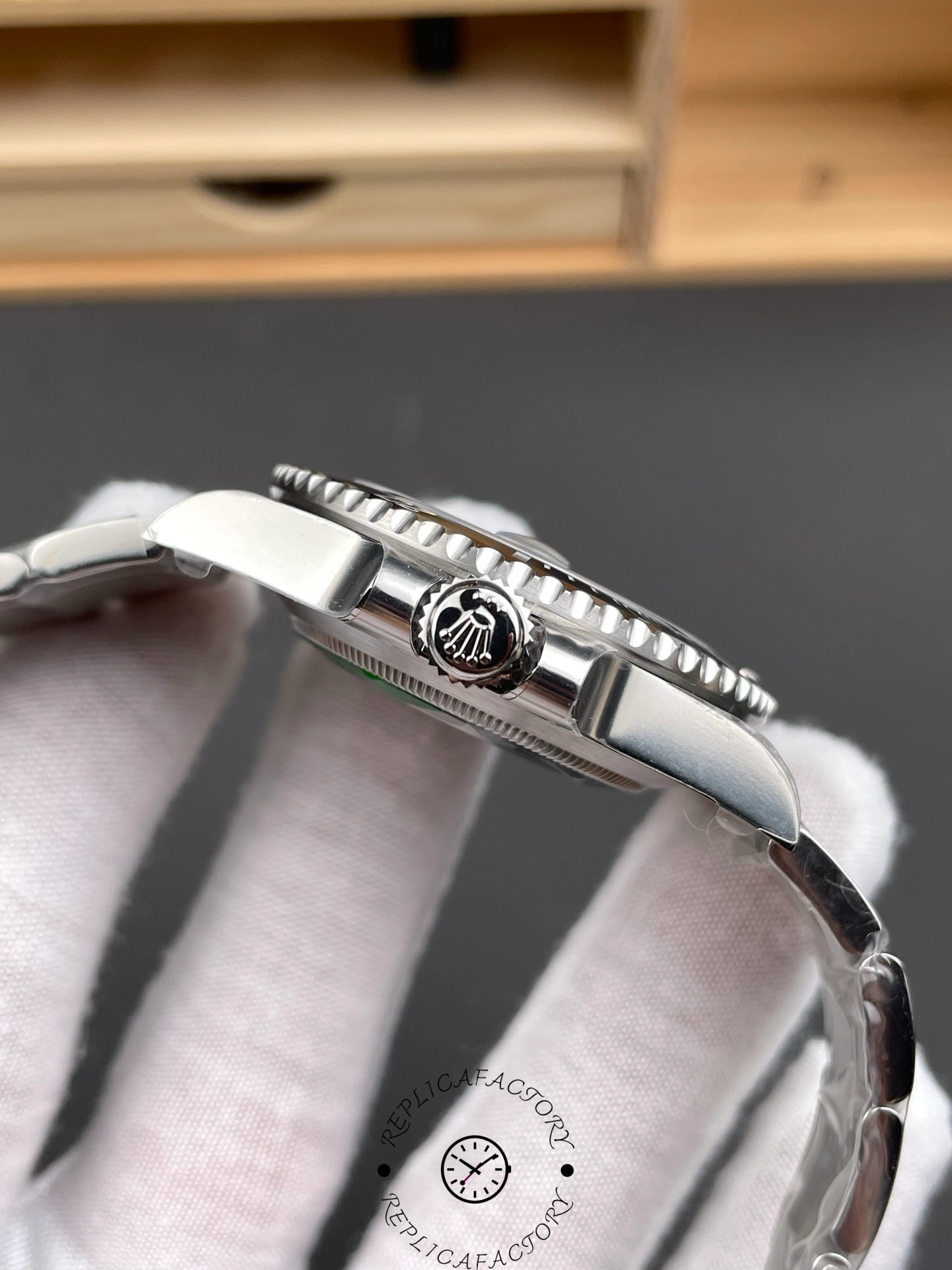 Rolex Submariner 126610LN 0001 side view, focusing on crown side and lugs.