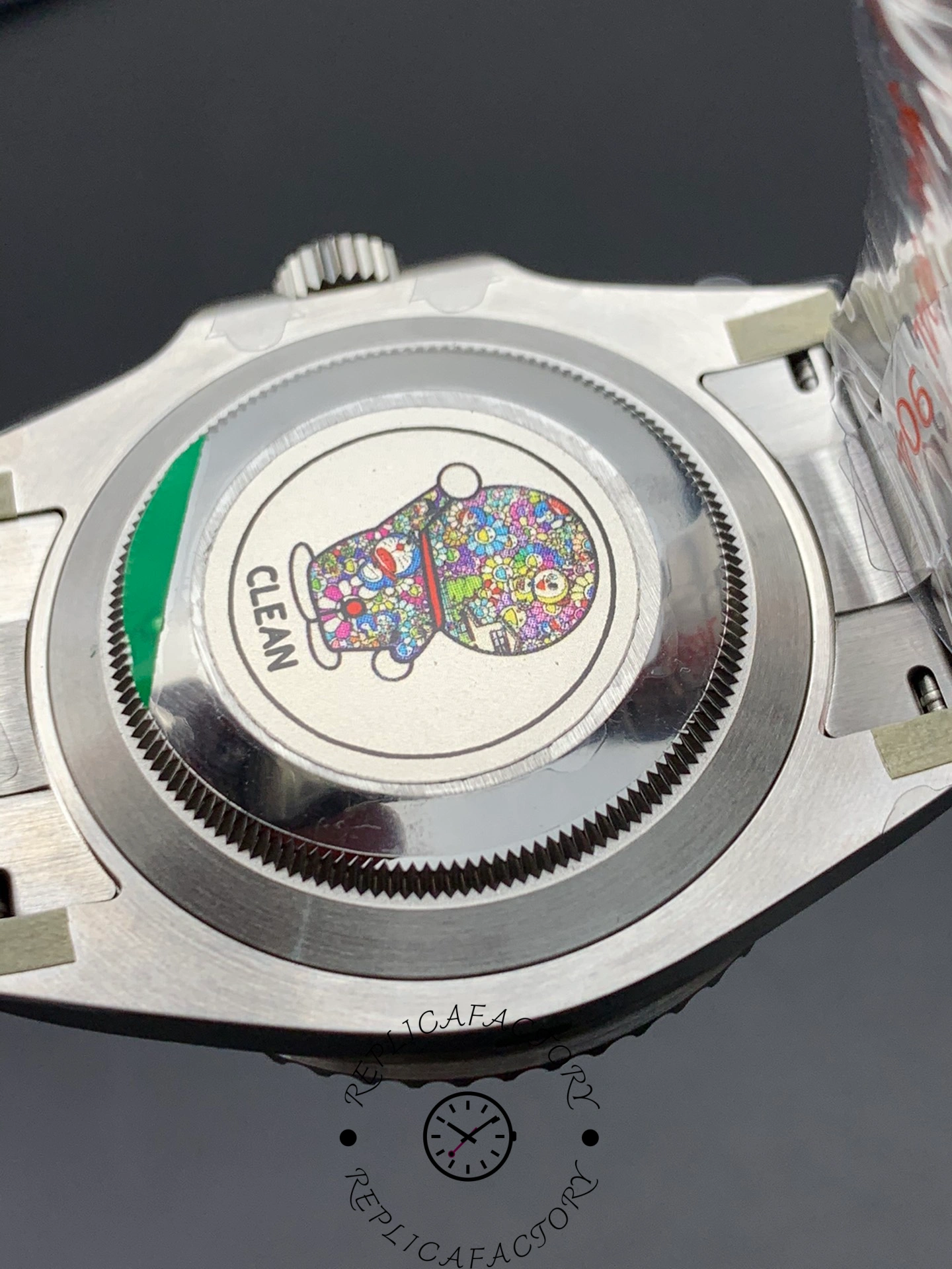 Rolex Submariner 116610LN caseback close-up, solid back with protective sticker.