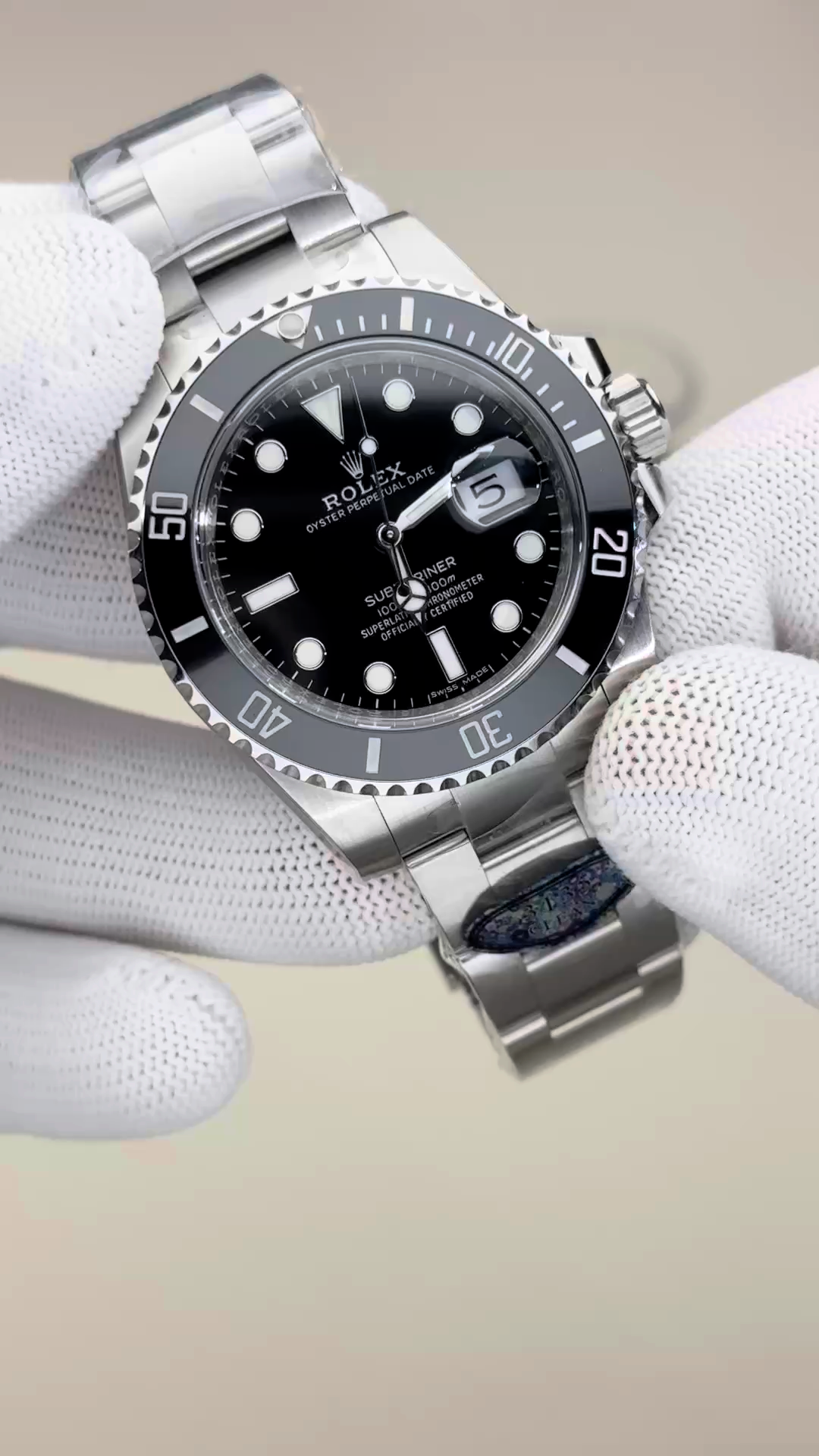 Rolex Submariner 116610LN video, white-glove hold showing black dial and bezel. - Video