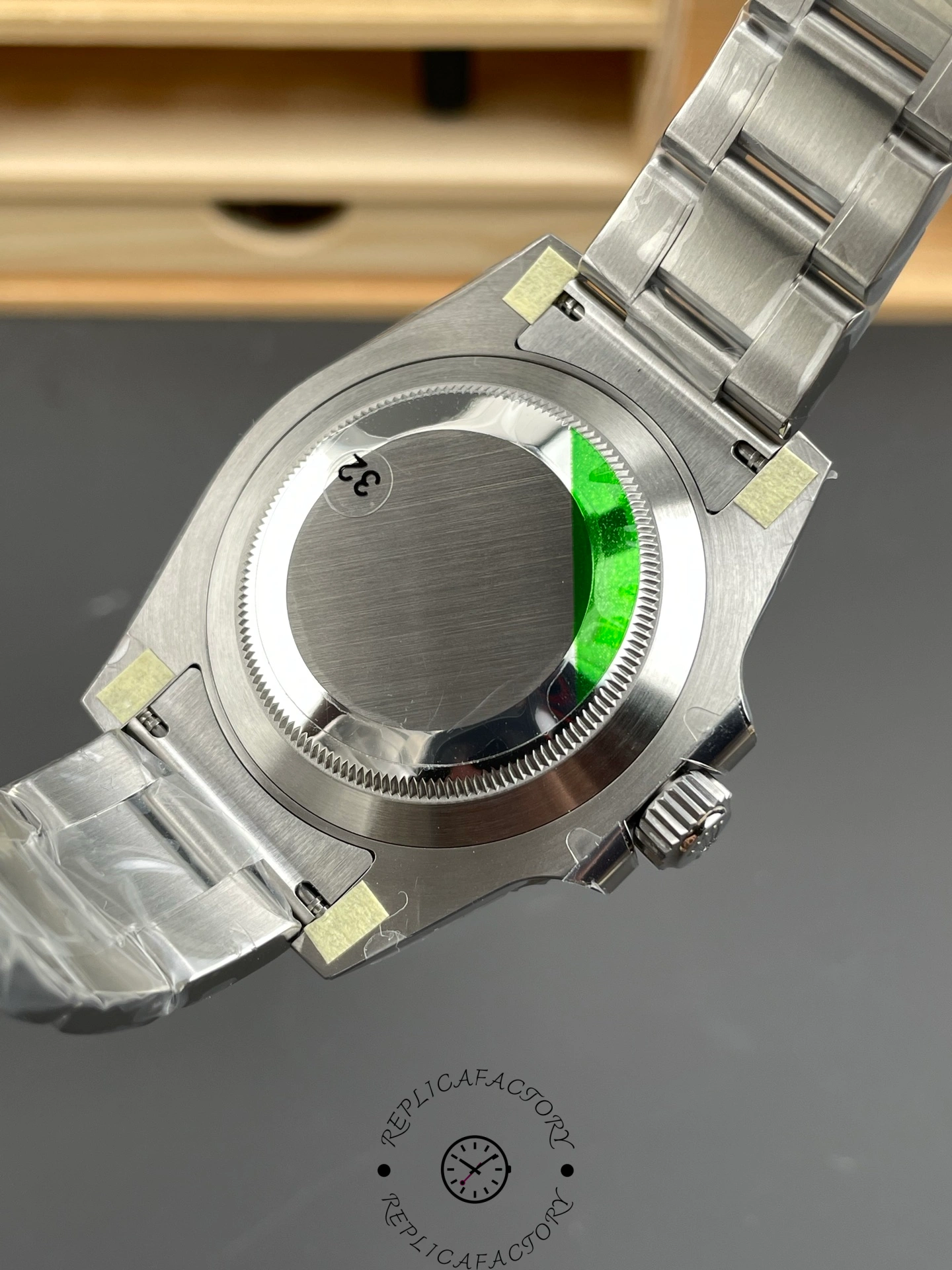 Rolex Submariner 126610LN 0001 caseback view, Oyster bracelet and back cover visible.