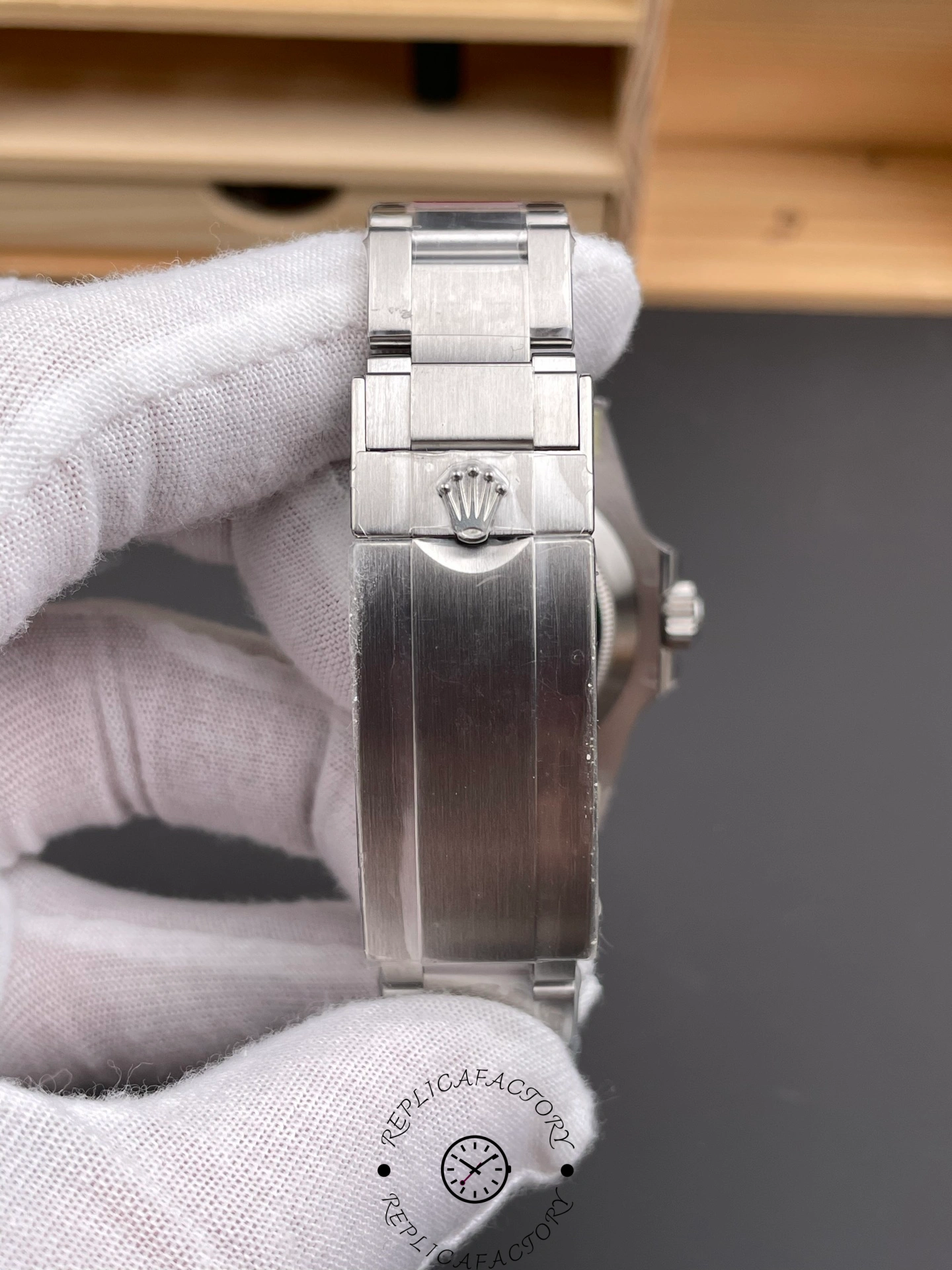 Rolex Submariner 126610LN 0001 bracelet close-up, showing links and tag detail.