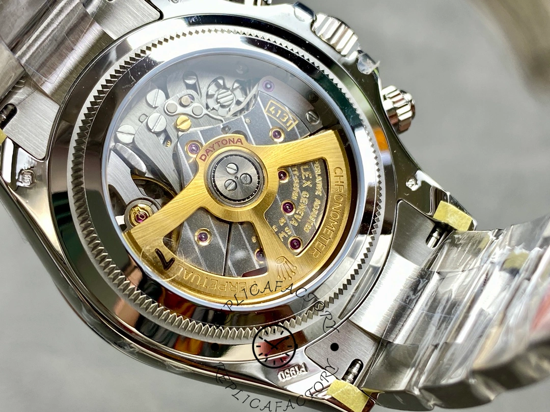 Movement close-up of Rolex Platinum Daytona 126506 through sapphire back, gold rotor visible.