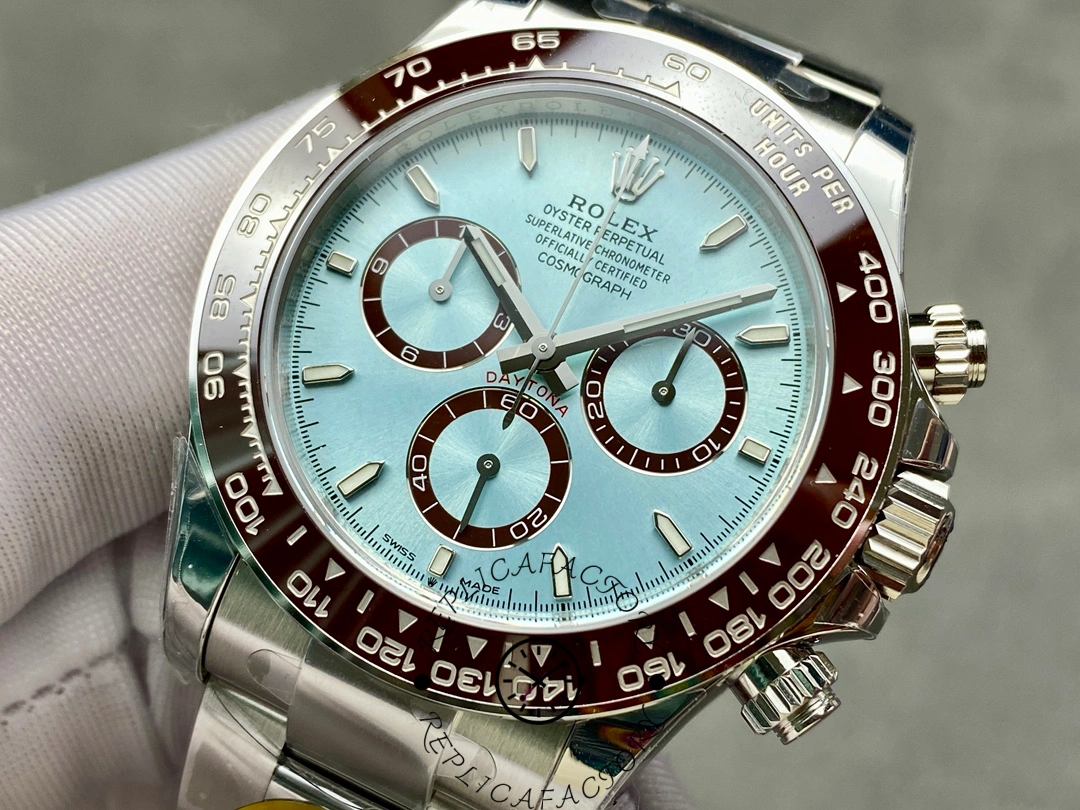 Angled close-up of Rolex Platinum Daytona 126506 with brown bezel and polished case.