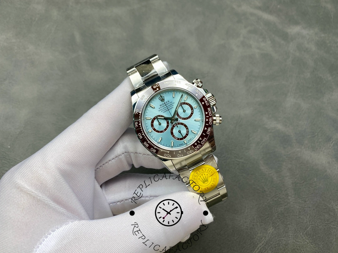 Hand-held full view of Rolex Platinum Daytona 126506 showing dial and bracelet together.