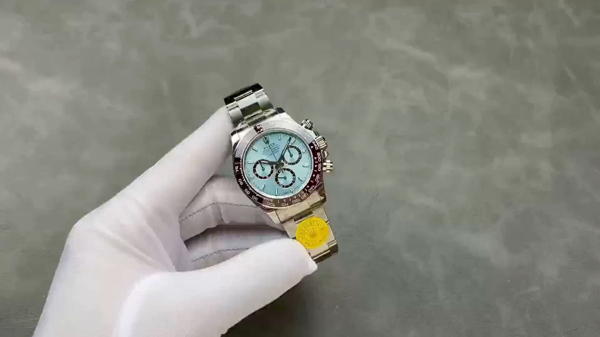 Video of Rolex Platinum Daytona 126506, glove-held shot focusing on bracelet.