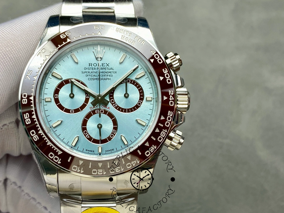 Glove-held front view of Rolex Platinum Daytona 126506, ice blue index dial.