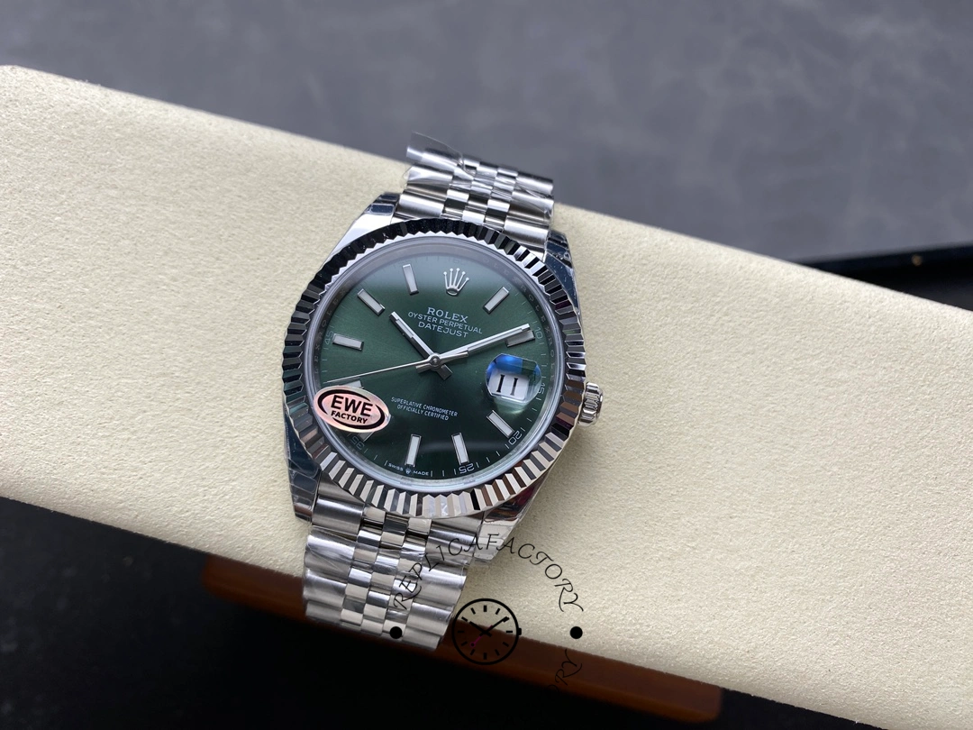 Full view of the Rolex Datejust 126334-0028 resting on a cushion with Jubilee bracelet.