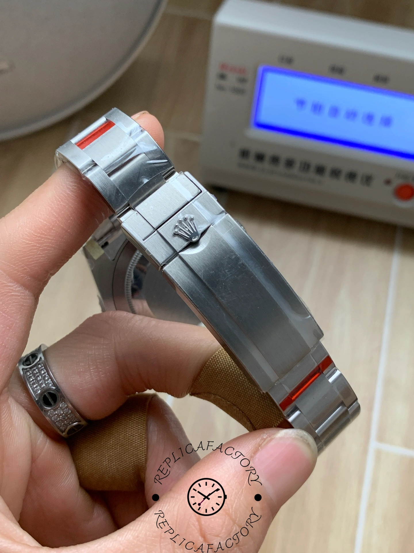 Rolex Submariner 126619LB 0003, clasp close-up showing adjustment section.