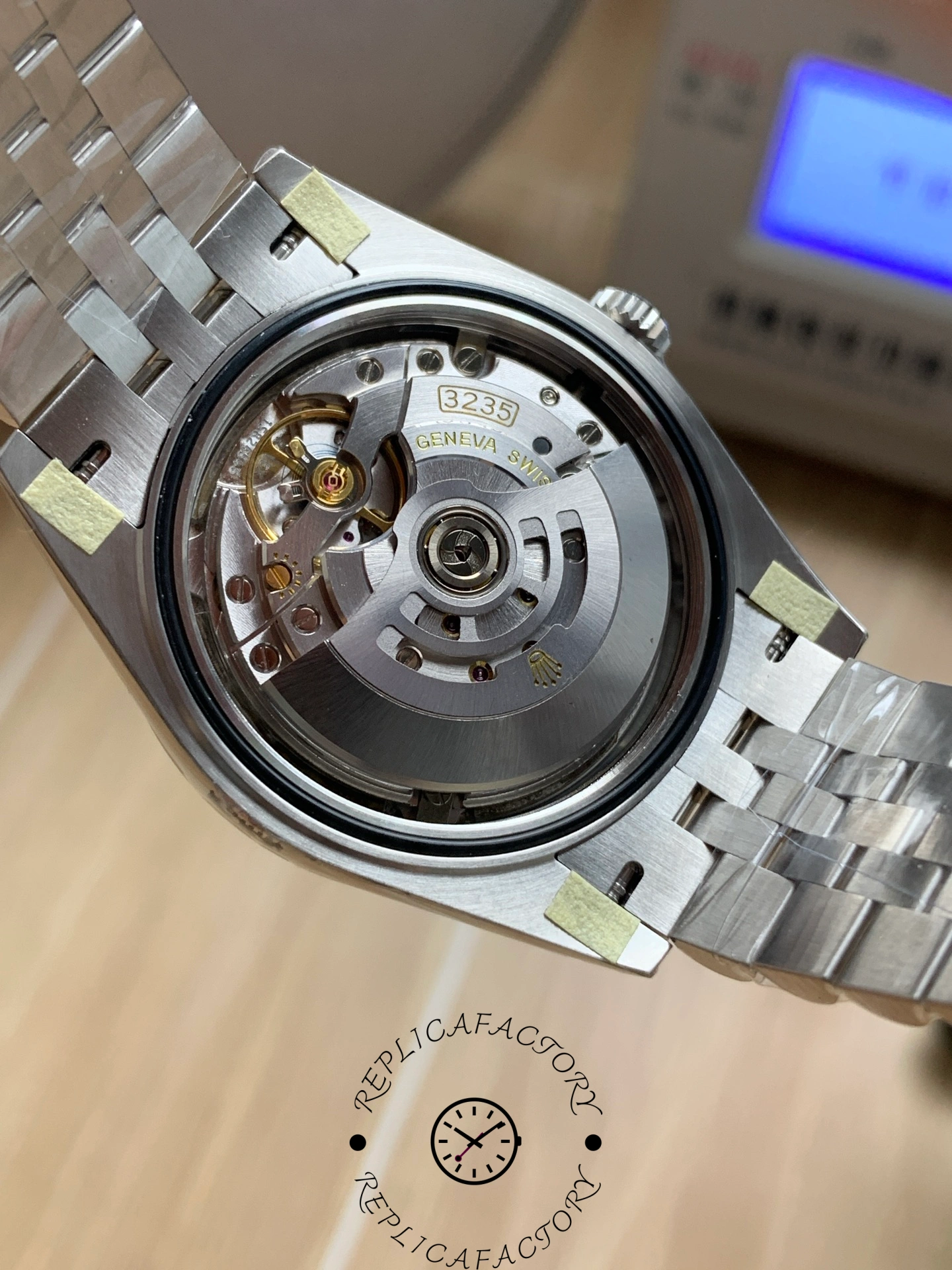 Movement view of the Rolex Datejust 126334-0028 showing the automatic rotor through the open caseback.
