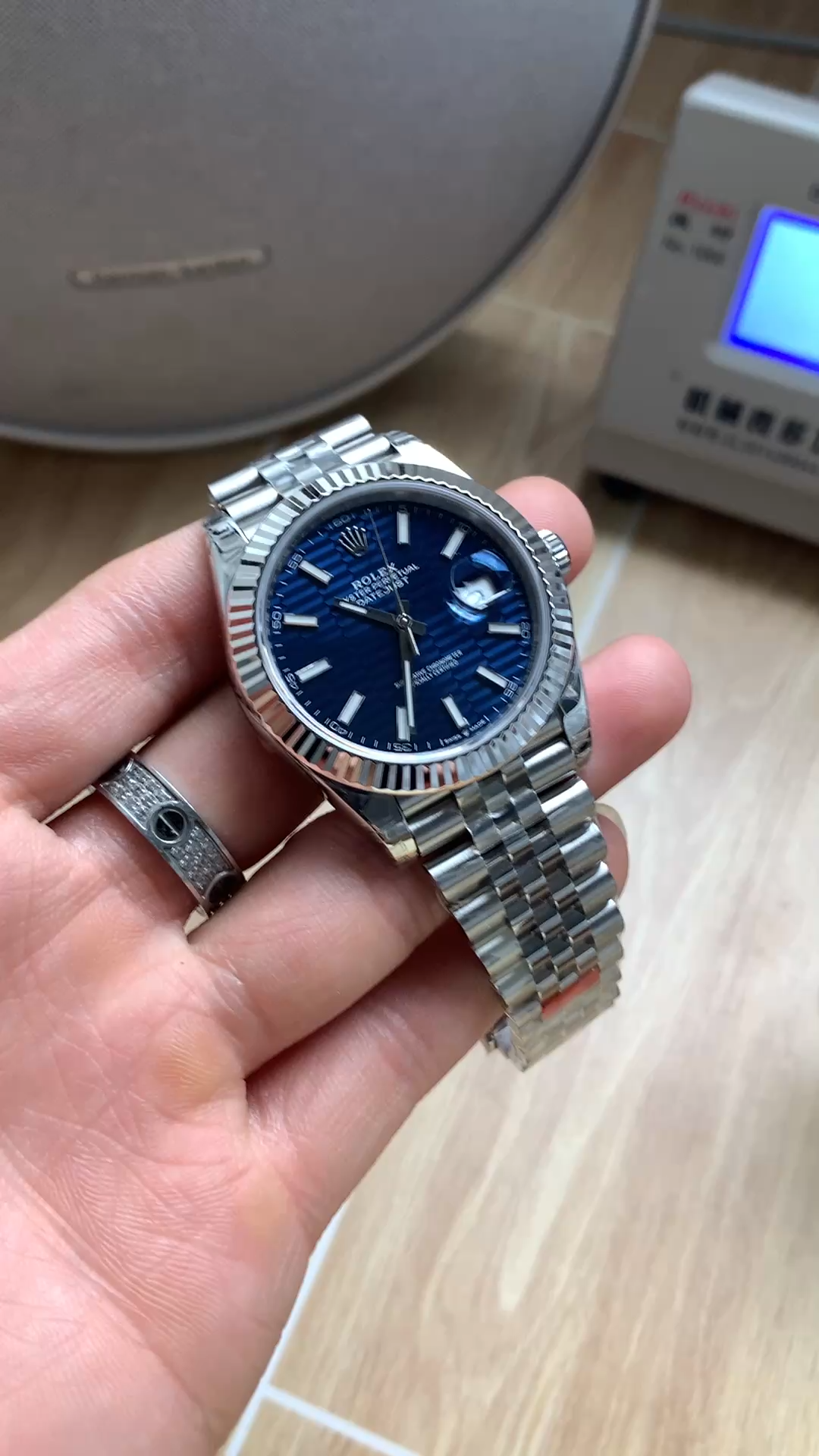 Handheld side view of Rolex Datejust 41 126334, showing the case profile and Jubilee bracelet. - Video