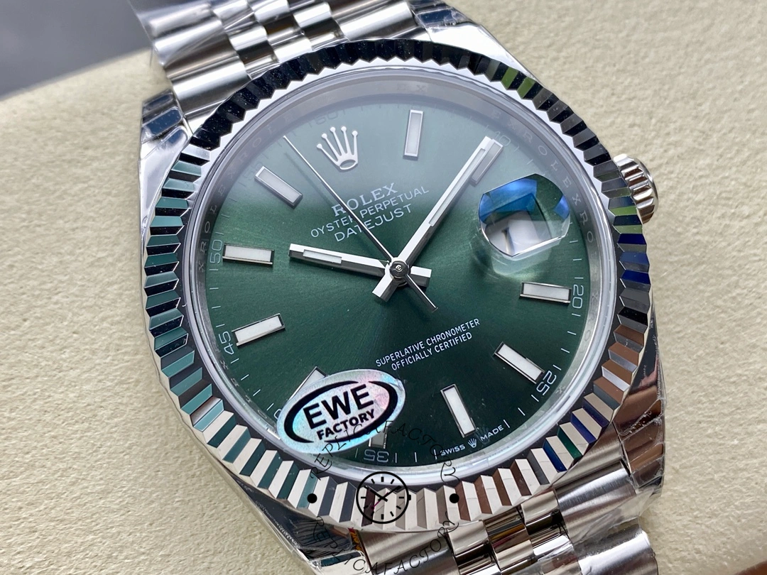 Dial close-up of the Rolex Datejust 126334-0028 showing the green sunburst dial and date display.
