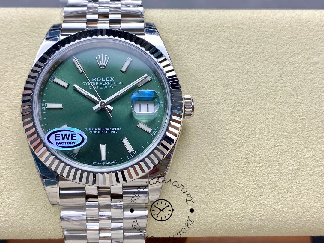 Front view of the Rolex Datejust 126334-0028 with green dial, fluted bezel, and date magnifier.