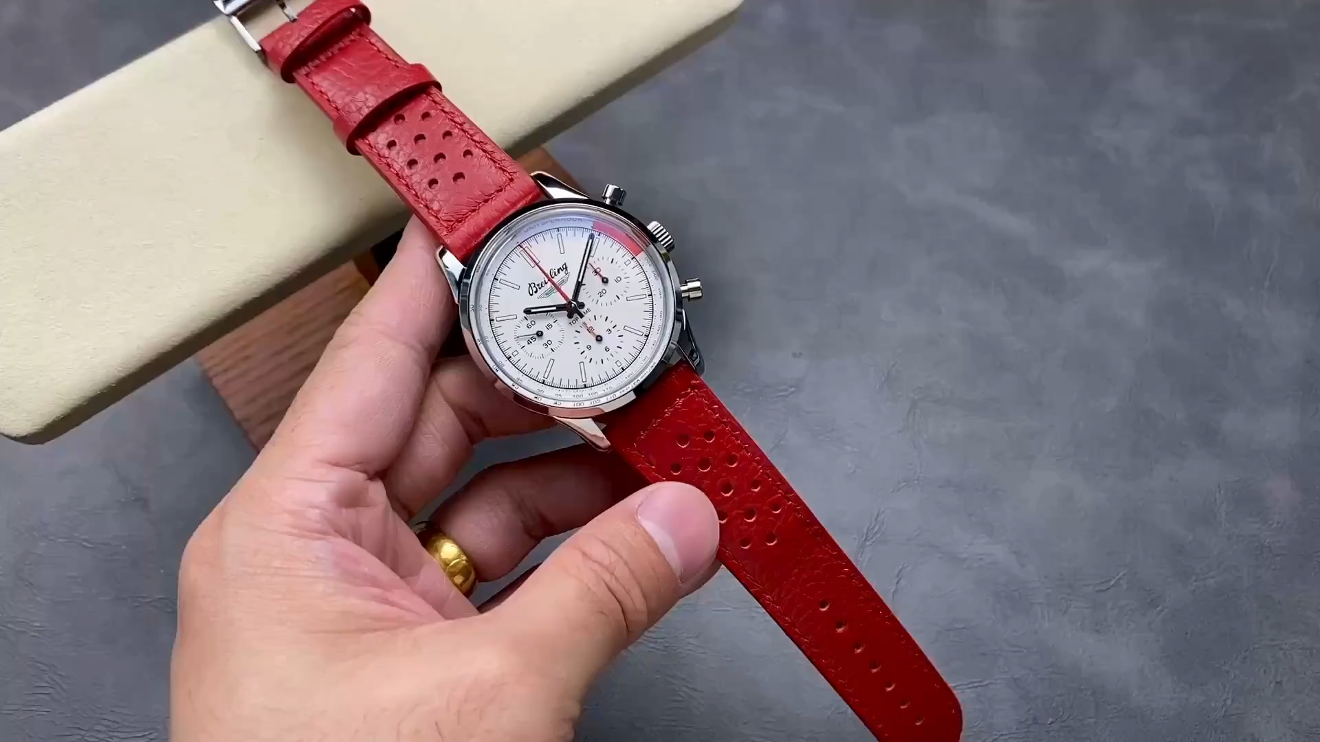 Breitling Top Time B01 Ford Thunderbird AB01766A1A1X1, cushion video showing red leather strap. - Video
