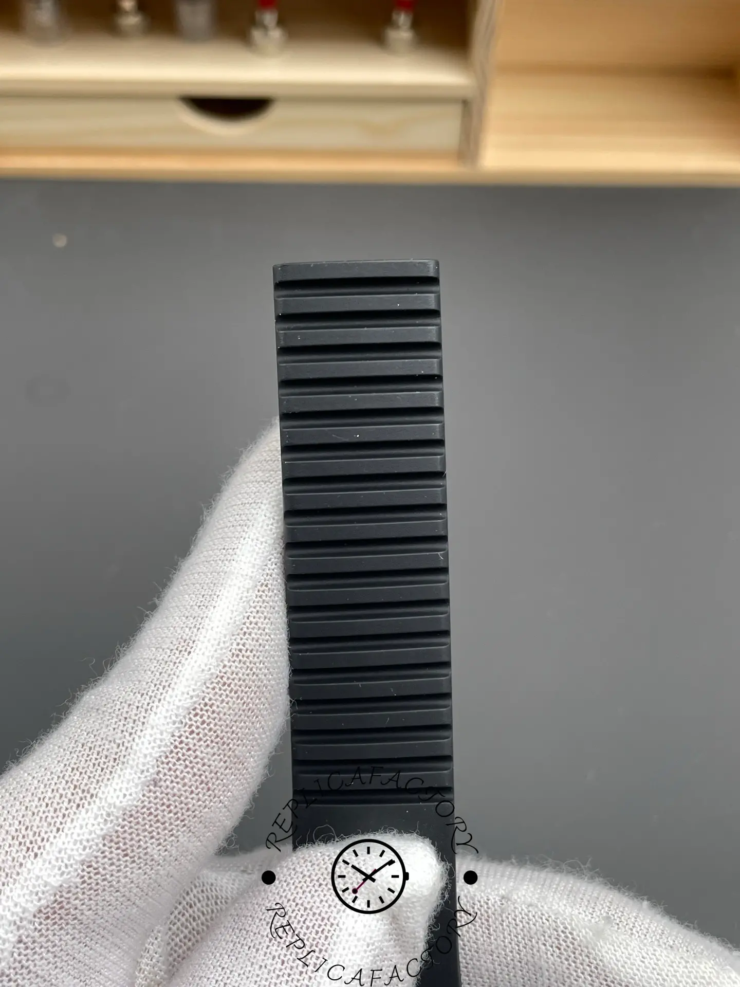 Strap texture close-up for Patek Philippe Aquanaut 5167A-001 showing rubber pattern and grooves.