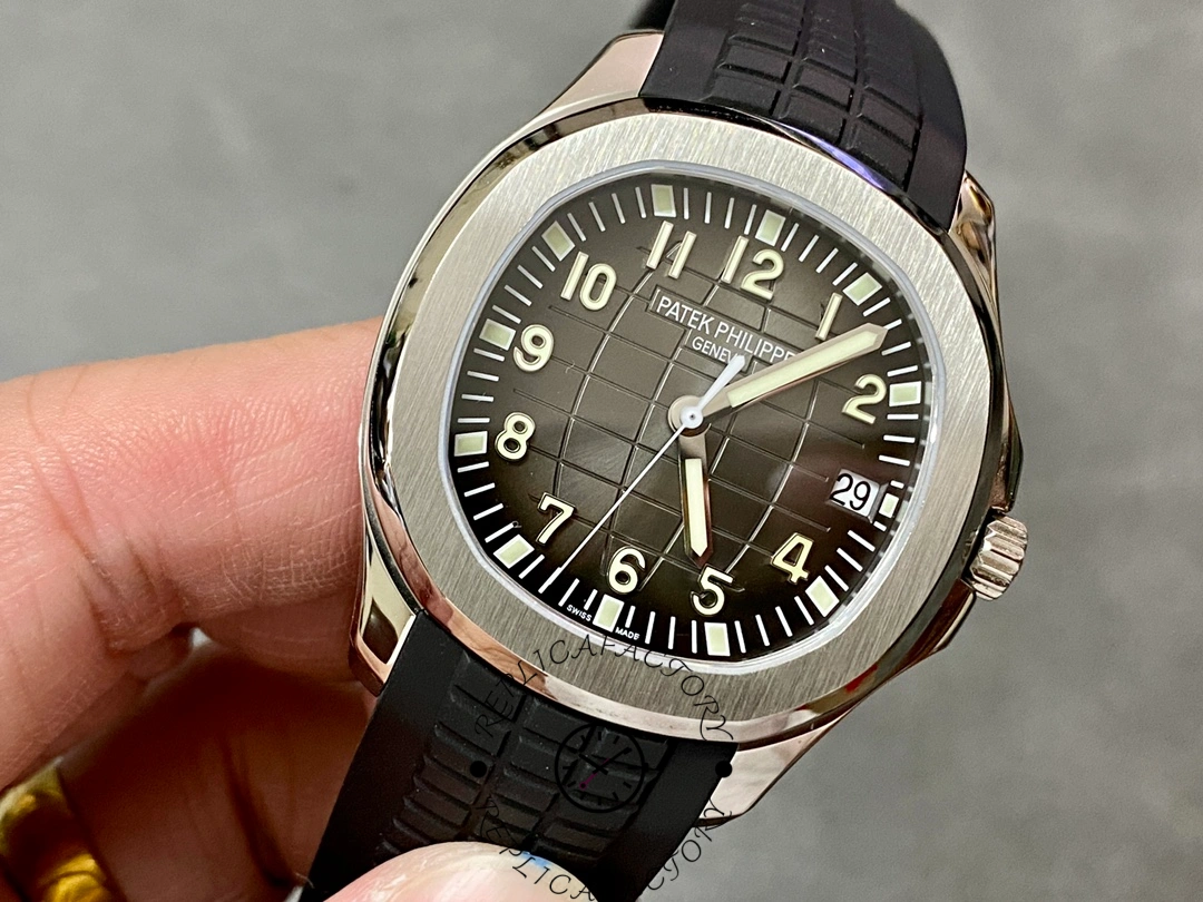 Dial close-up of Patek Philippe Aquanaut 5167A-001 showing luminous numerals and hands.