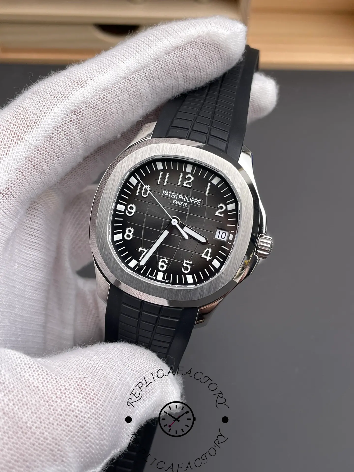 Front close-up of Patek Philippe Aquanaut 5167A-001 showing minute track, indices, and date window.