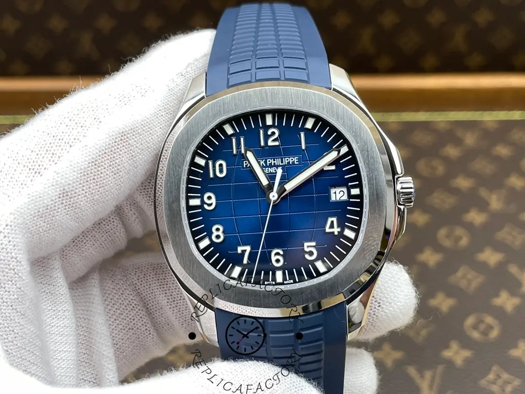 Glove hand shot of Patek Philippe Aquanaut 5168G-001 showing blue dial and strap in natural light.
