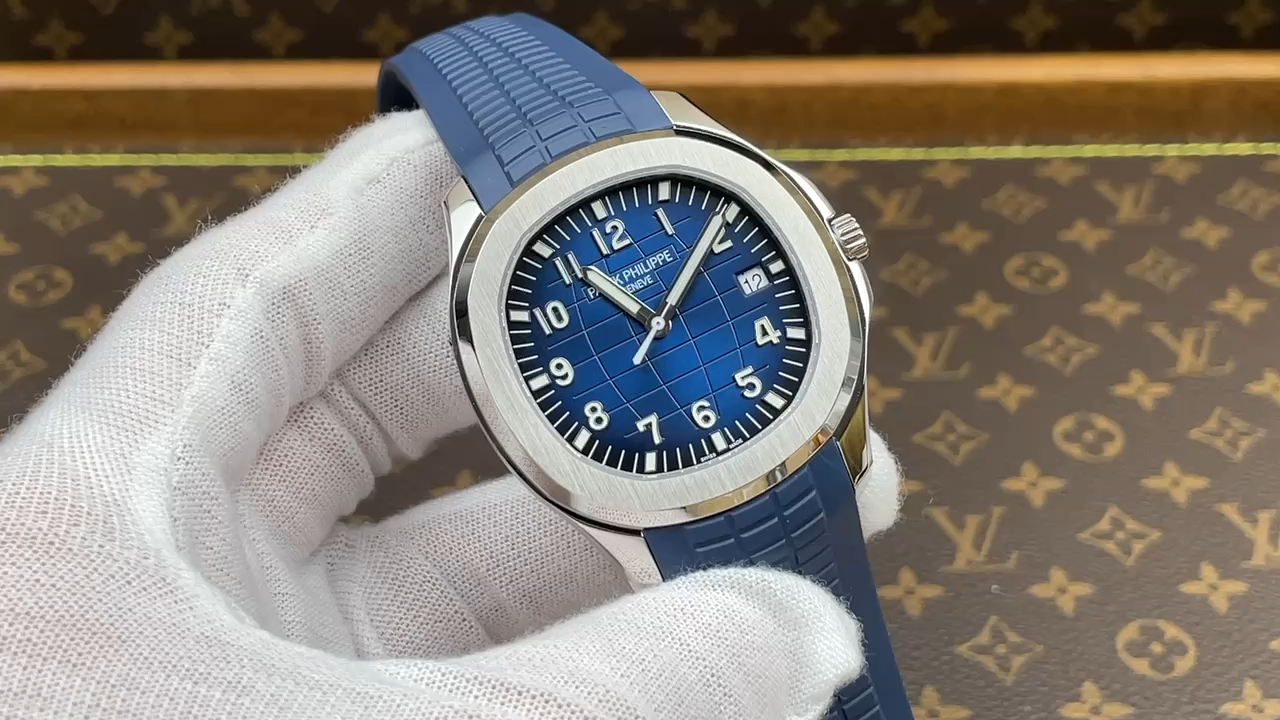 Video: glove hand close-up of Patek Philippe Aquanaut 5168G-001 showing dial clarity and bezel. - Video