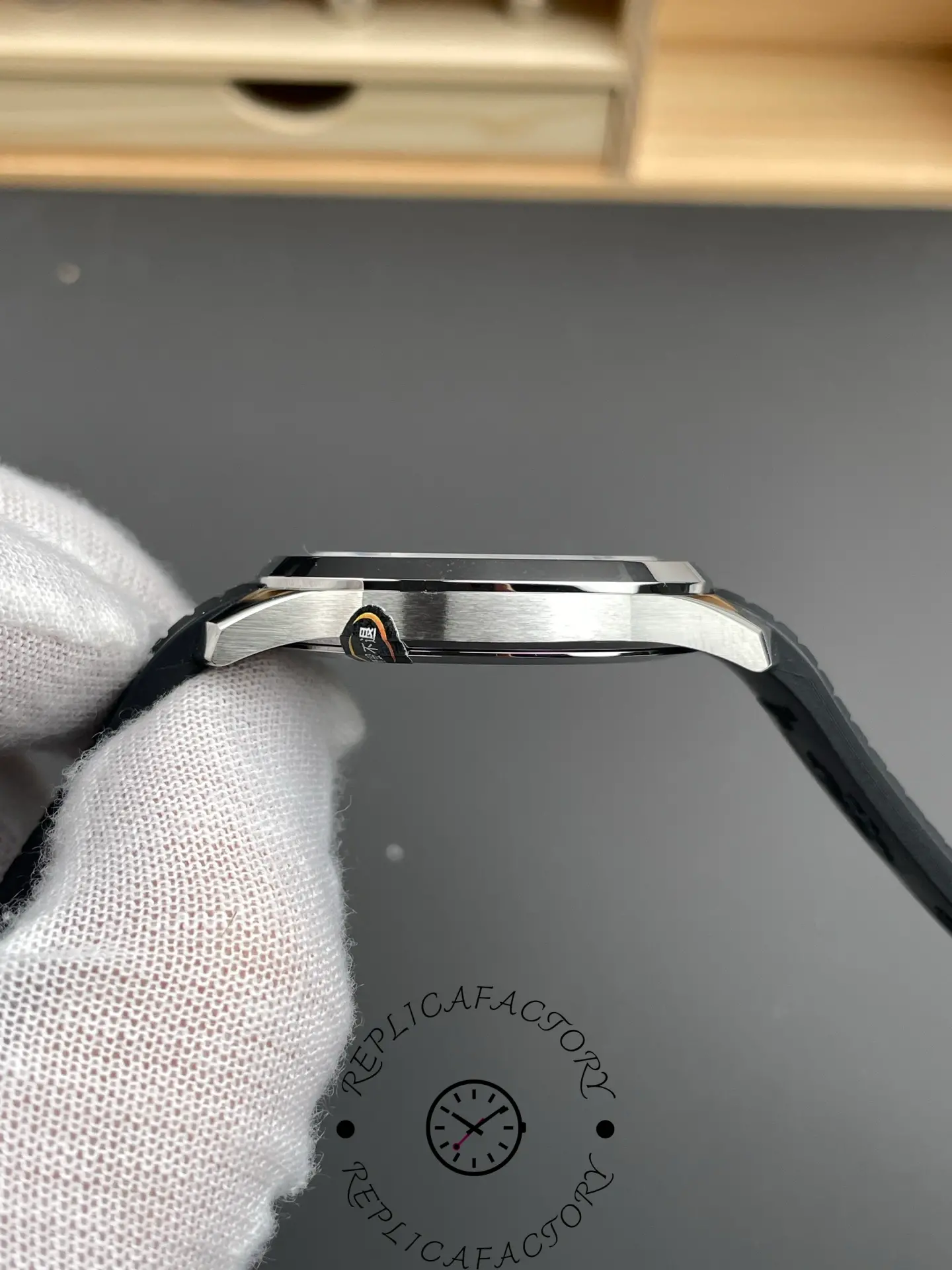 Low side view of Patek Philippe Aquanaut 5167A-001 showing bezel height and curved lugs.