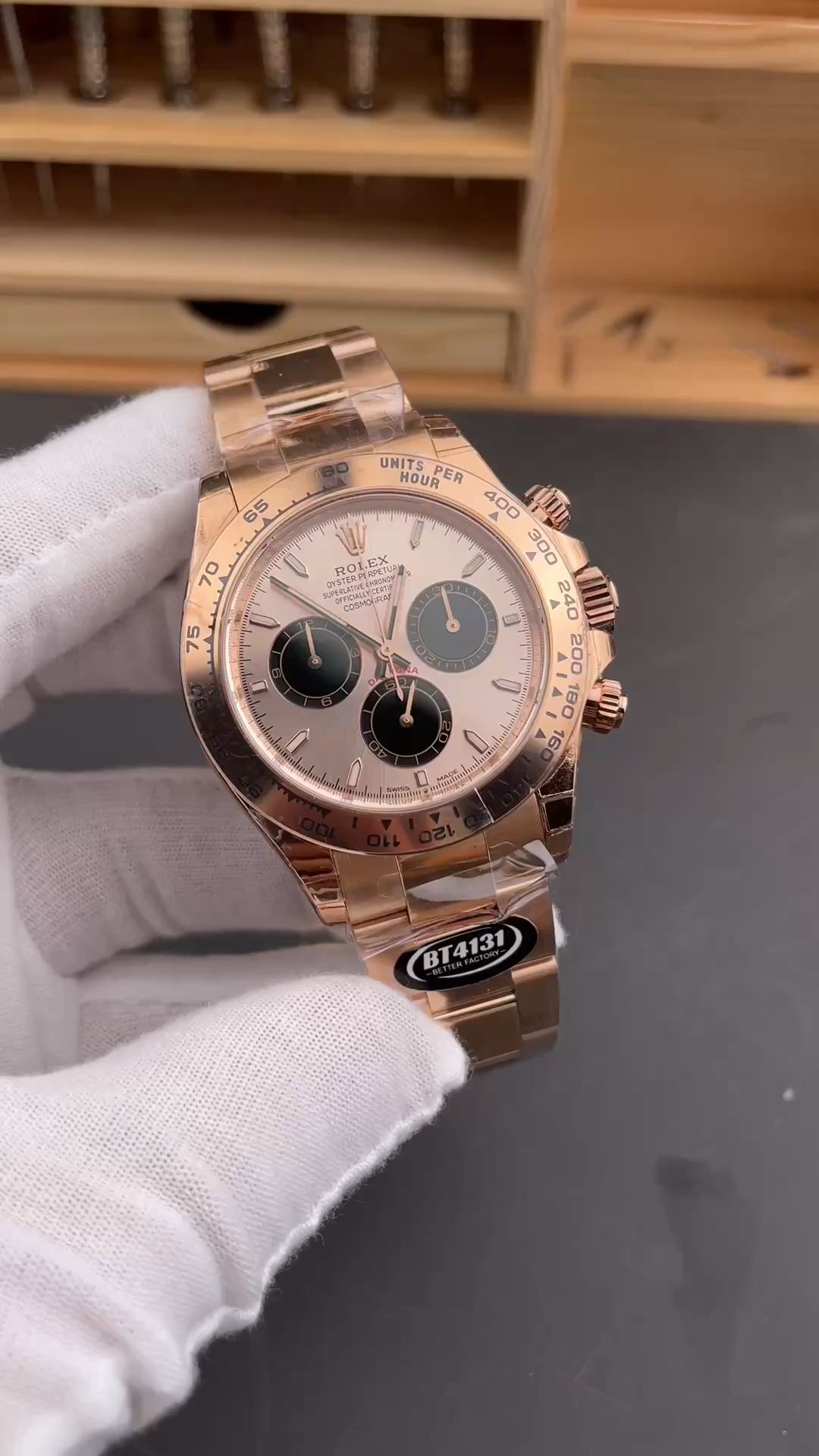 Hand-held video view of the Rolex Daytona 126505, sundust panda dial shown in hand. - Video
