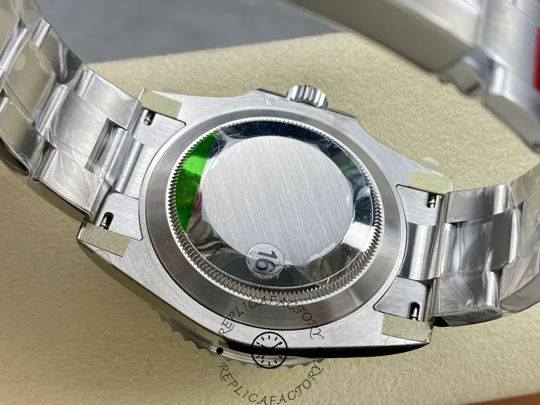 Rolex Submariner 124060, caseback close-up with green sticker.